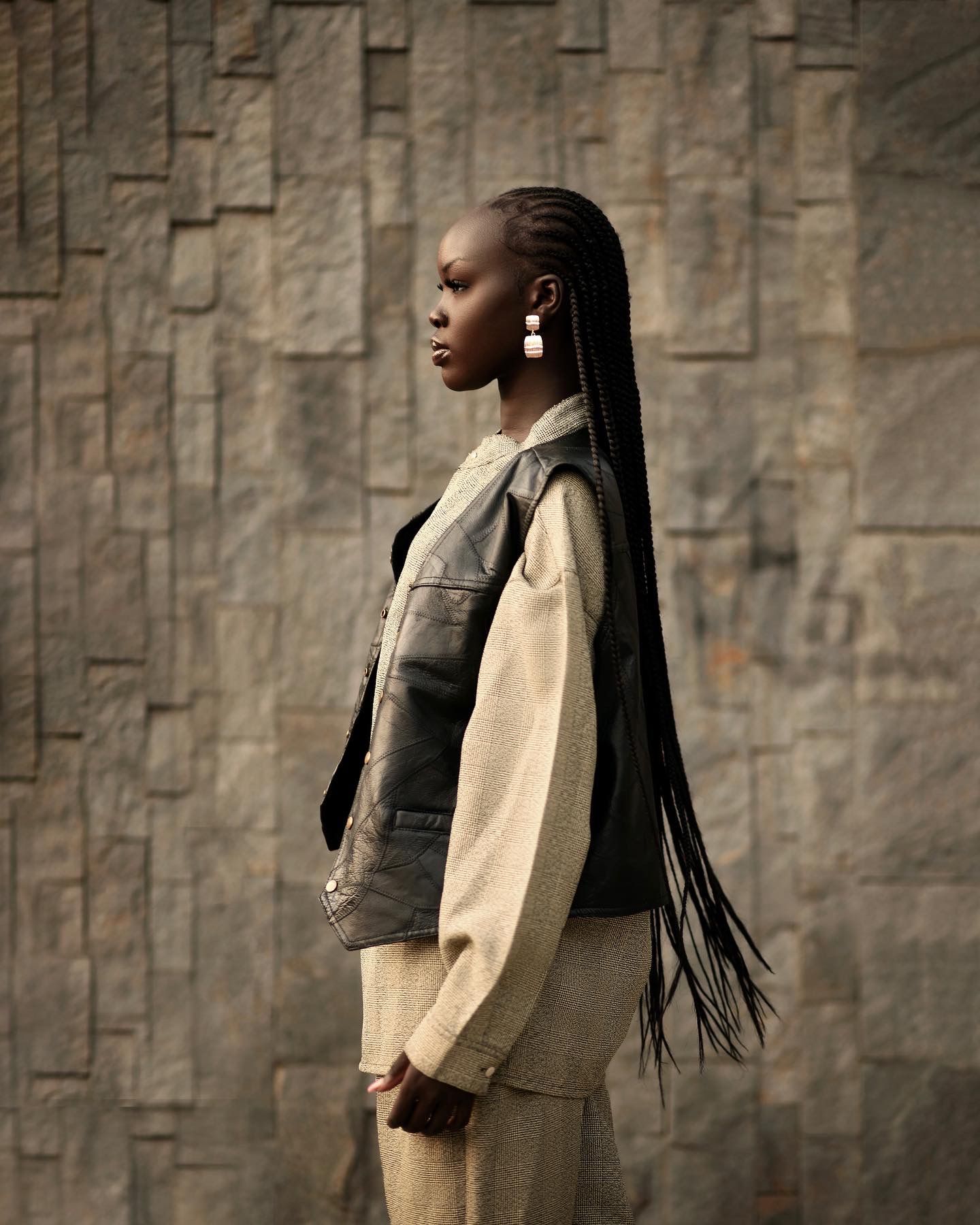 Fashion portrait series showing a beige blazer against a textured stone wall backdrop. Monica Atong for PZ STUDIO VISUALS