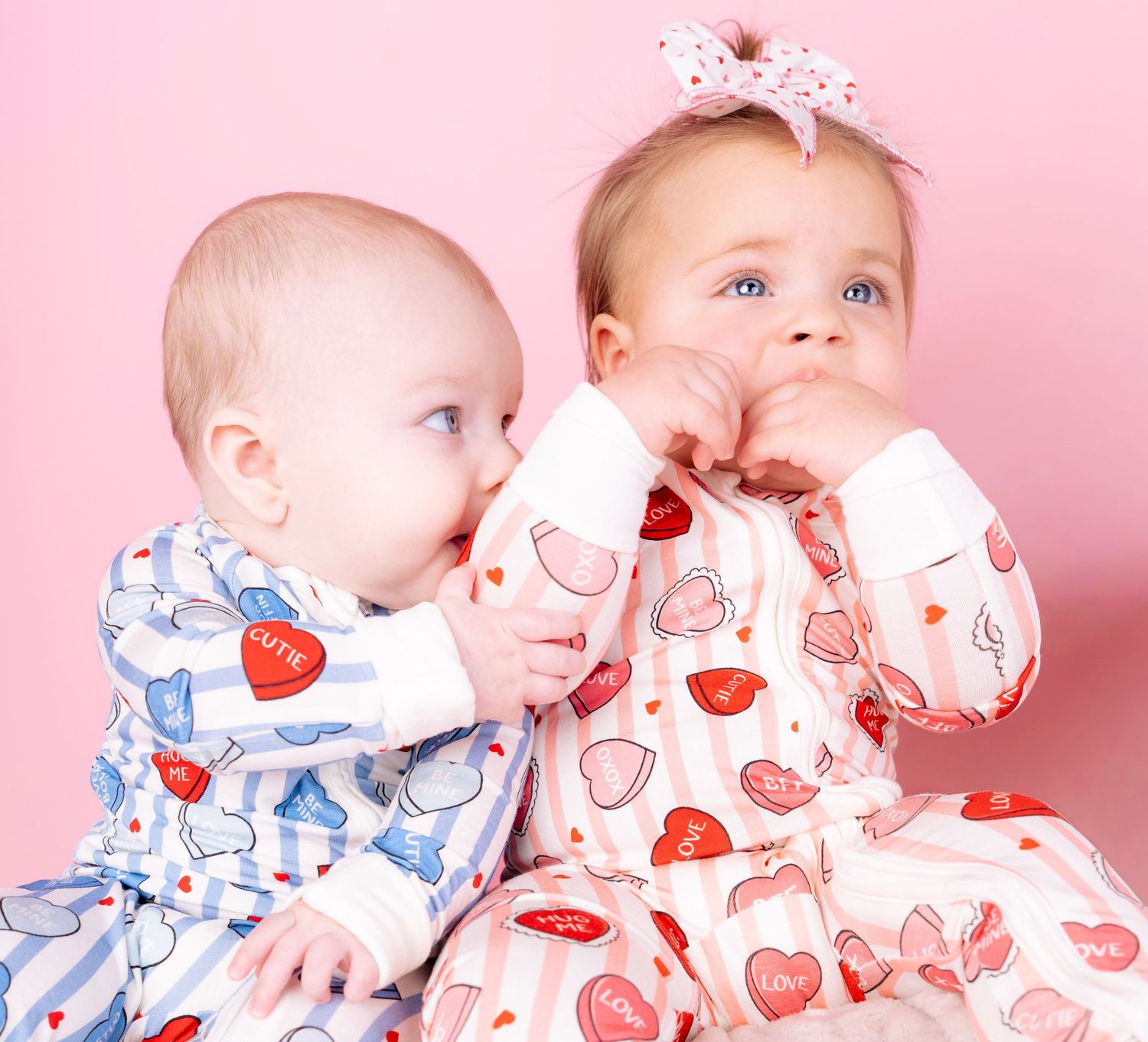 Heart patterned fabric creates a sweet Valentine's Day themed backdrop.