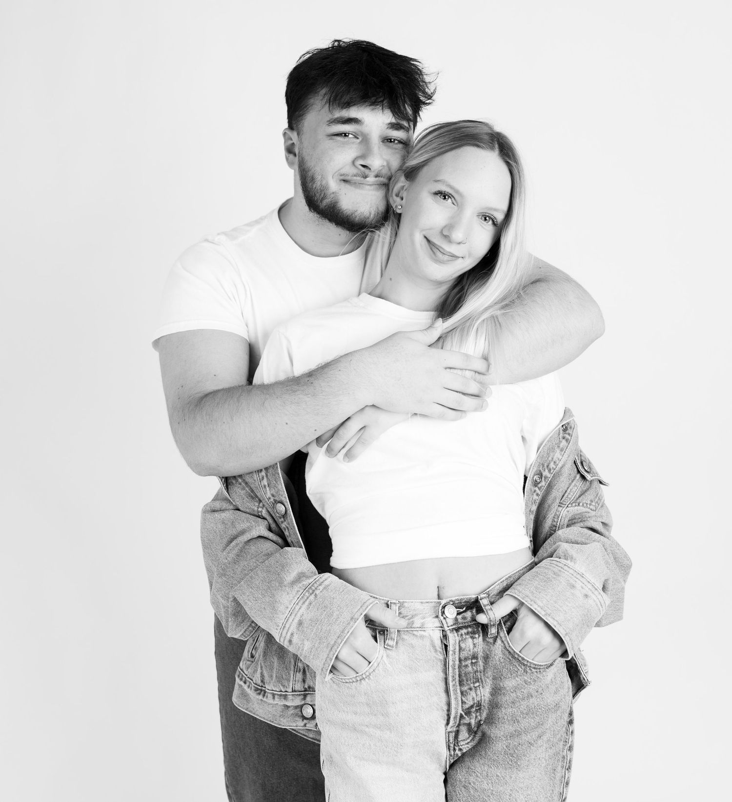 A series of black and white intimate couple photos showing affectionate embraces and casual poses.
