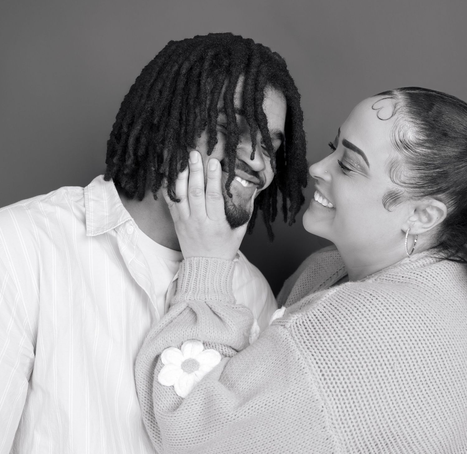 Black and white romantic portrait series showing intimate moments between a couple.