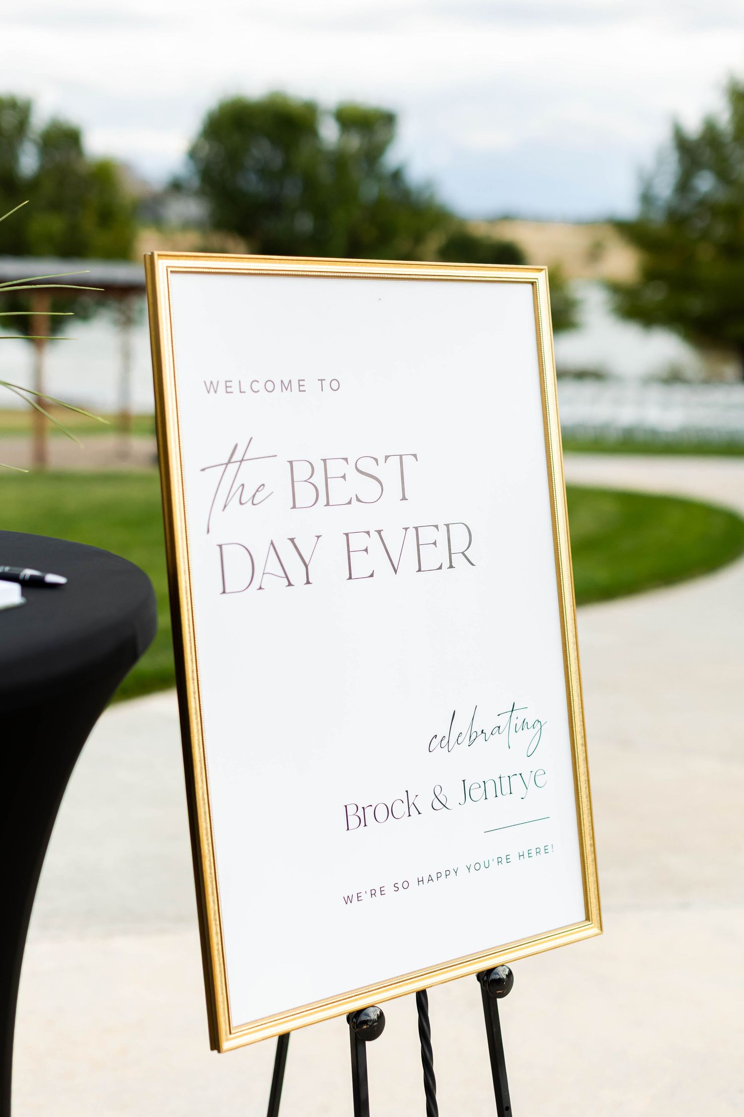 Elegant wedding welcome signs in gold frames display 'Best Day Ever' and celebratory text on white backgrounds.