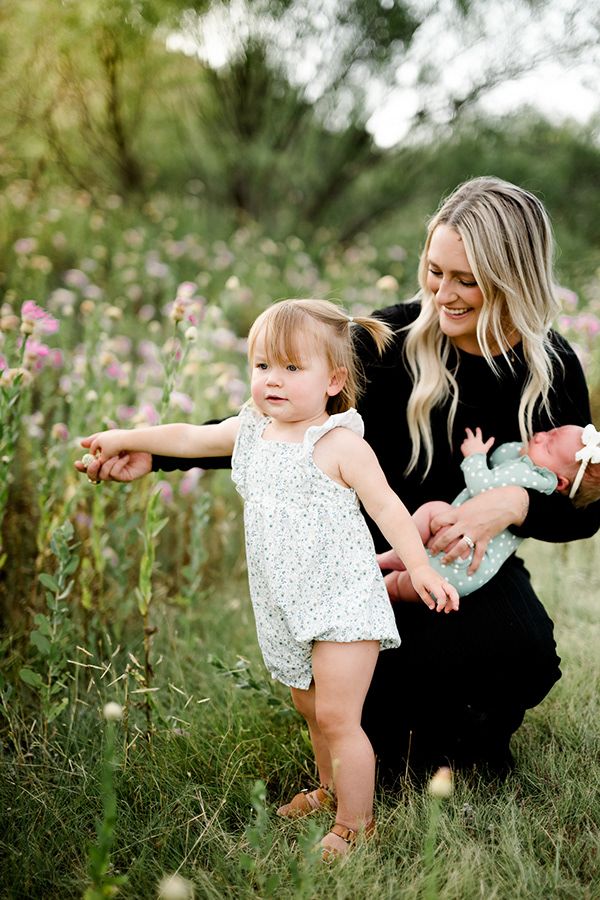 Candid moments of joy and laughter captured in a wildflower field during golden hour.