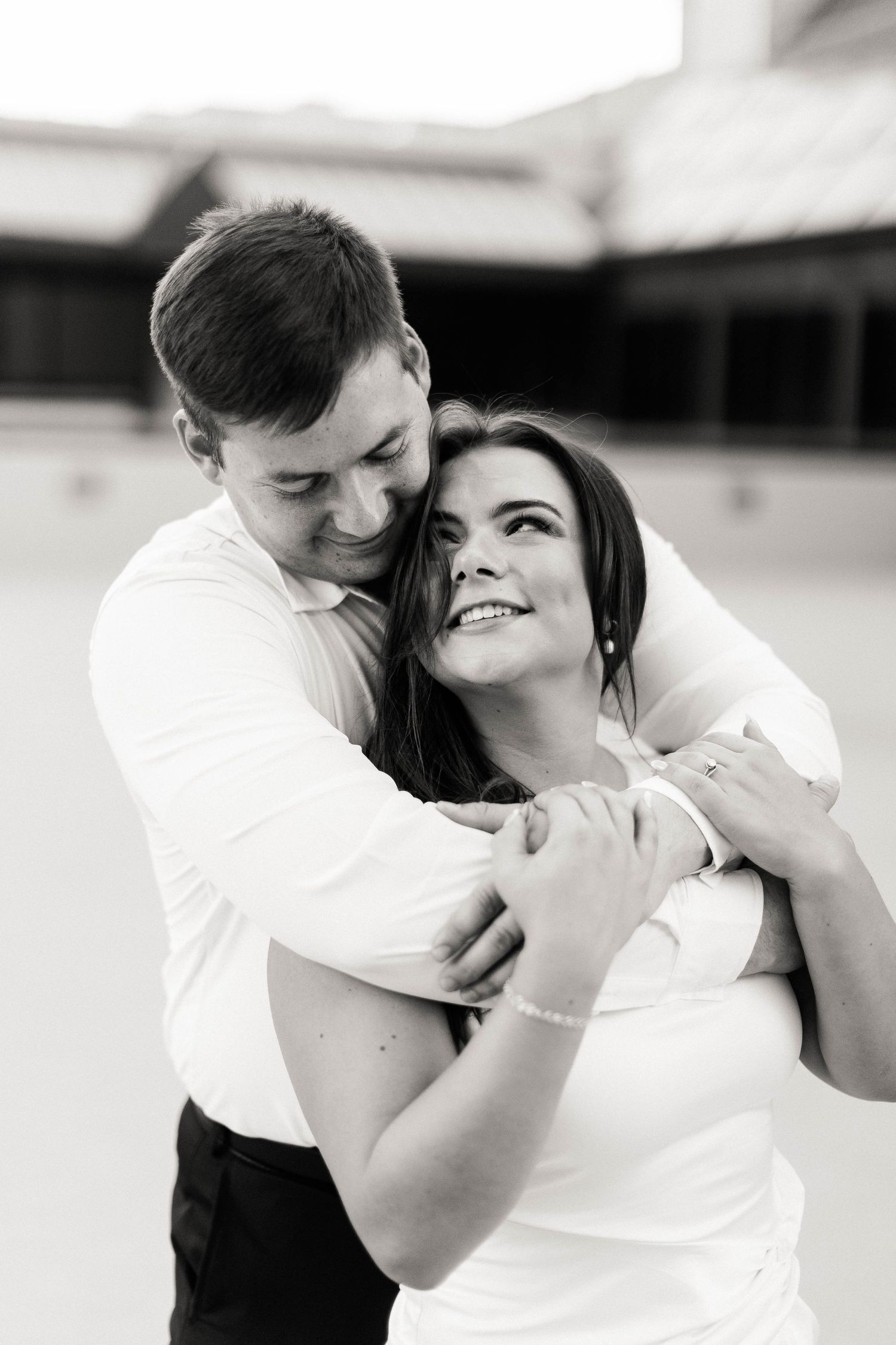 A black and white photo sequence captures intimate moments between a couple in formal attire.