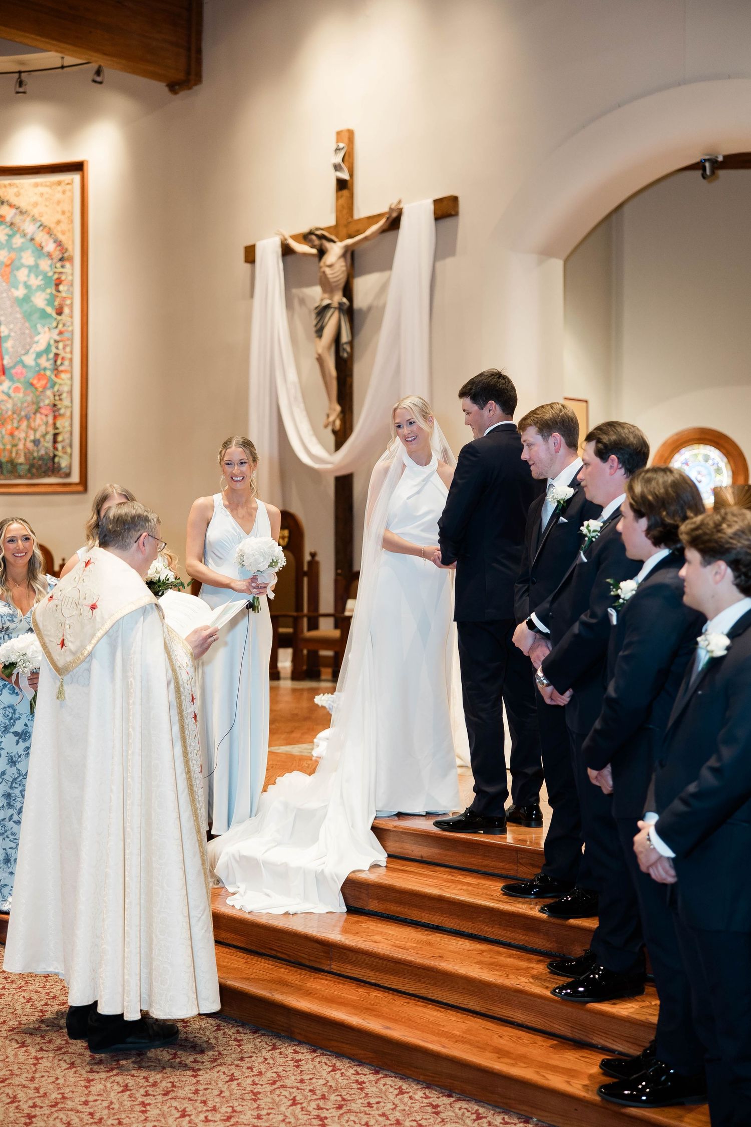 Wedding party performing choreographed movements during church ceremony.