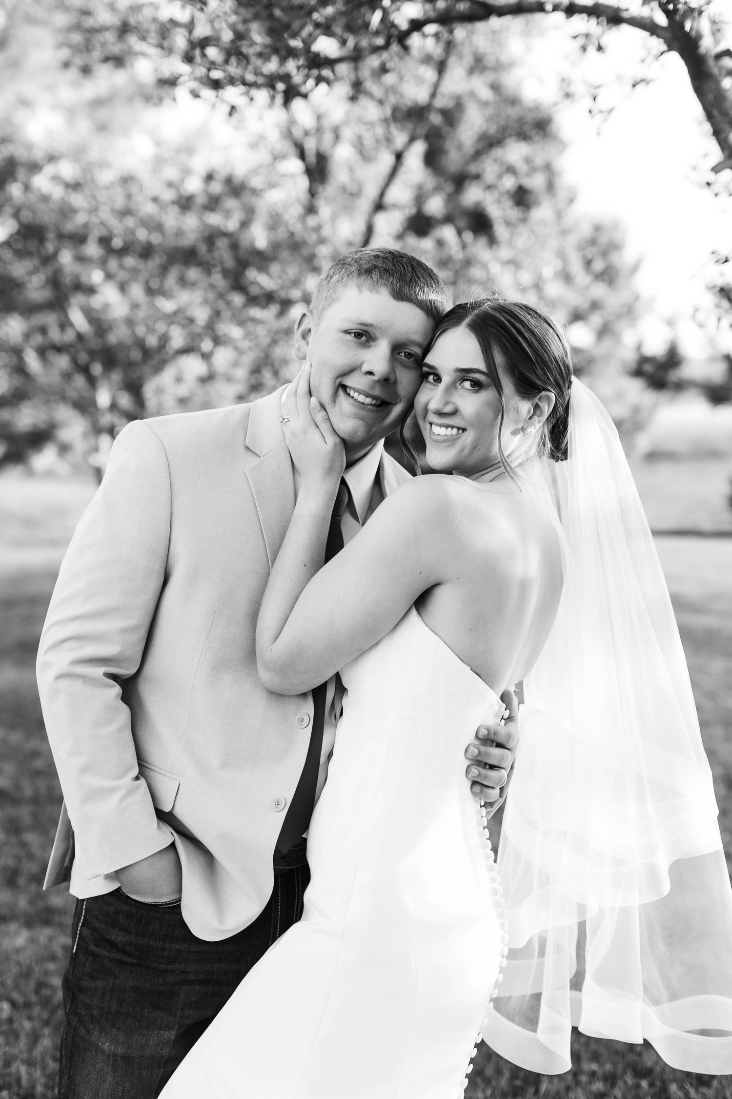 Black and white romantic wedding portraits capture intimate moments between the newlyweds.