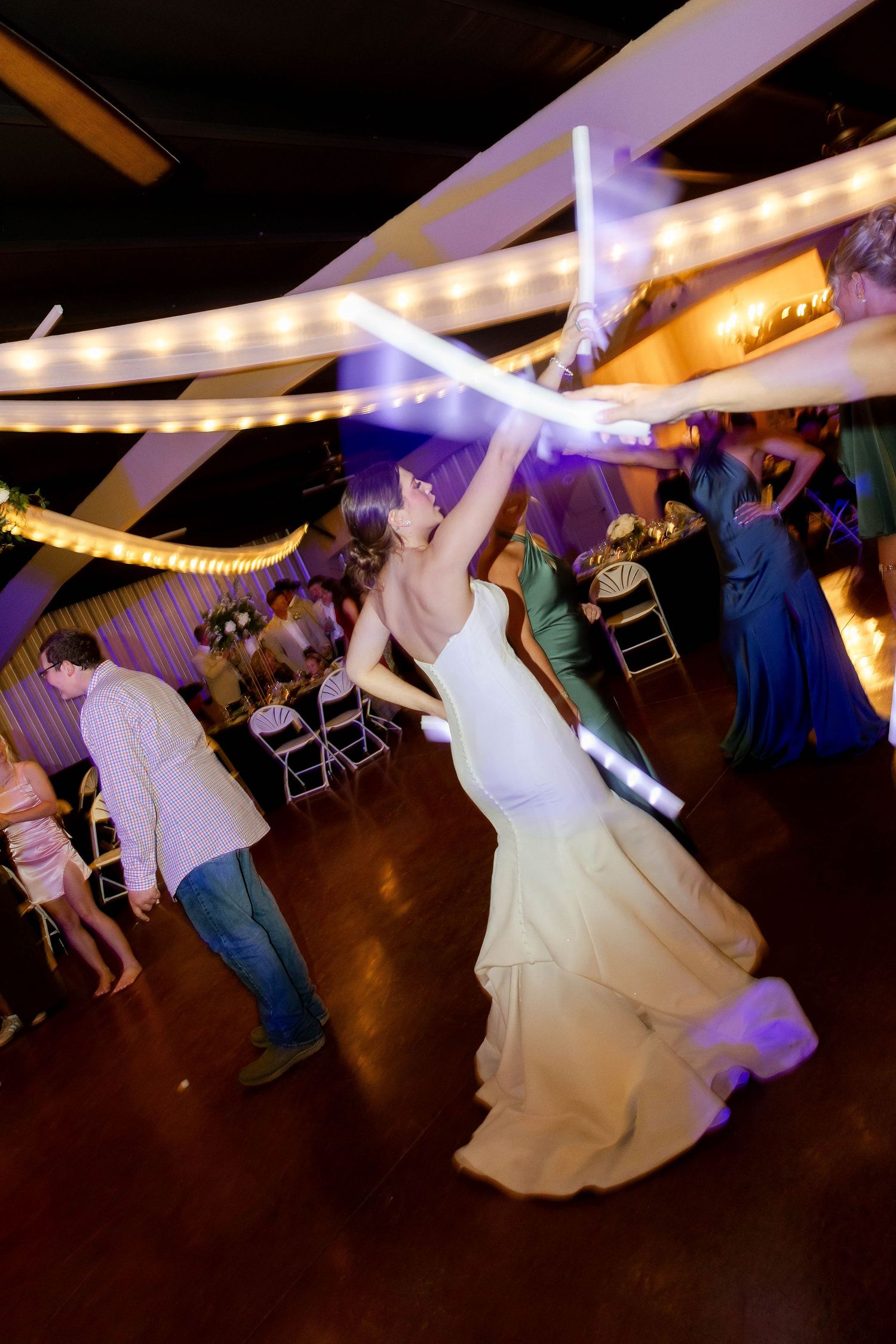 A sequence of dance floor photos showing wedding guests and a bride twirling and dancing at a reception party.