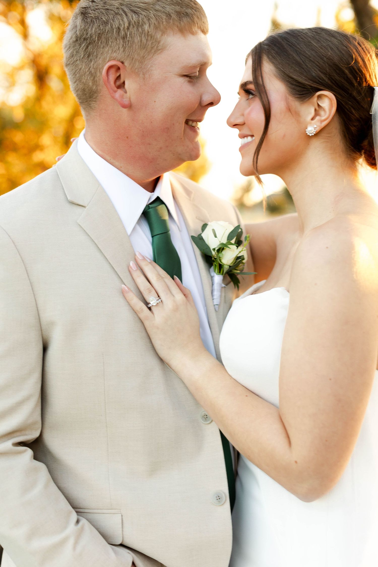 Romantic wedding portraits captured during golden hour with soft natural lighting.