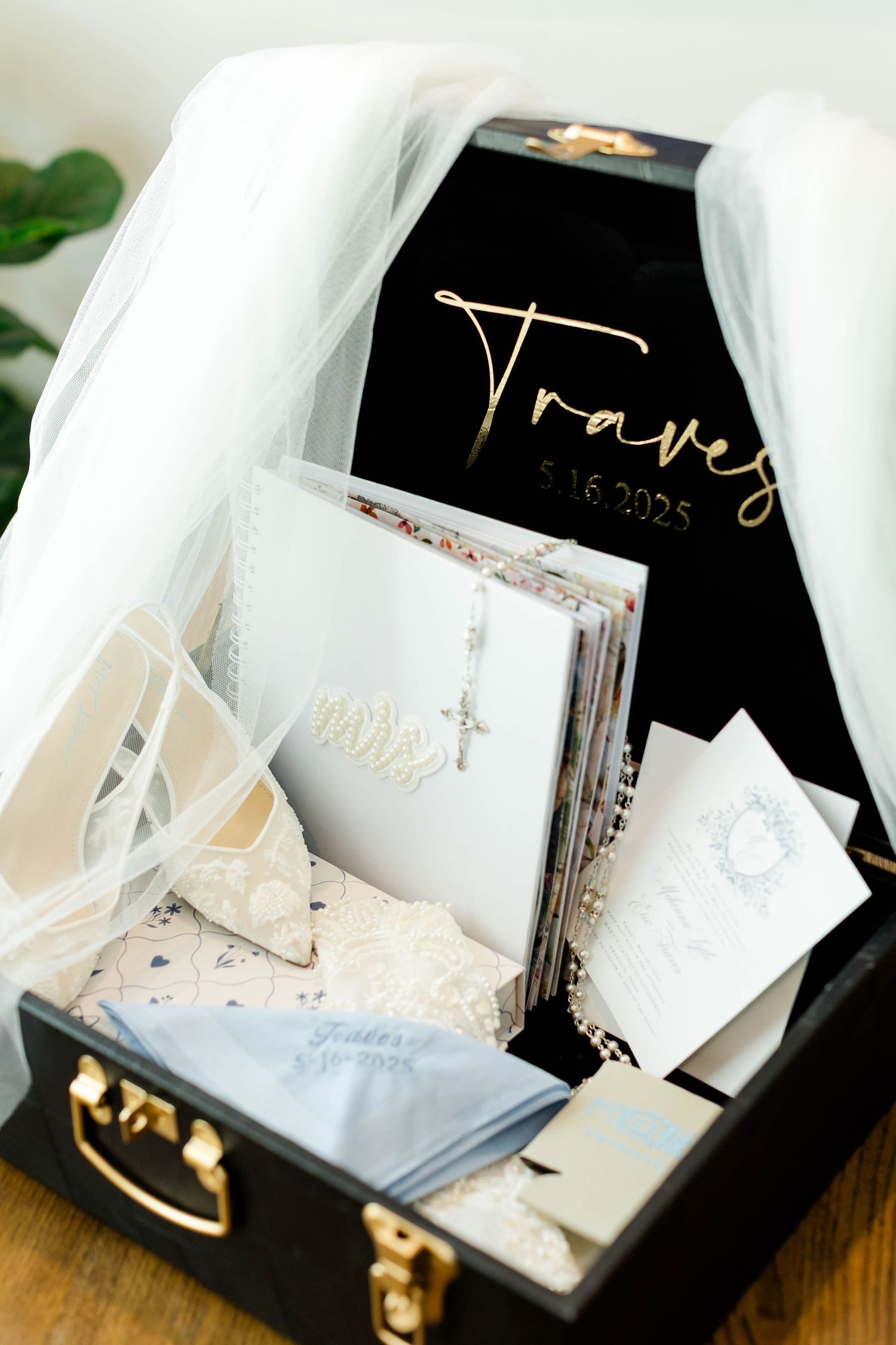 Wedding stationery and invitation suite displayed in elegant black and white packaging.