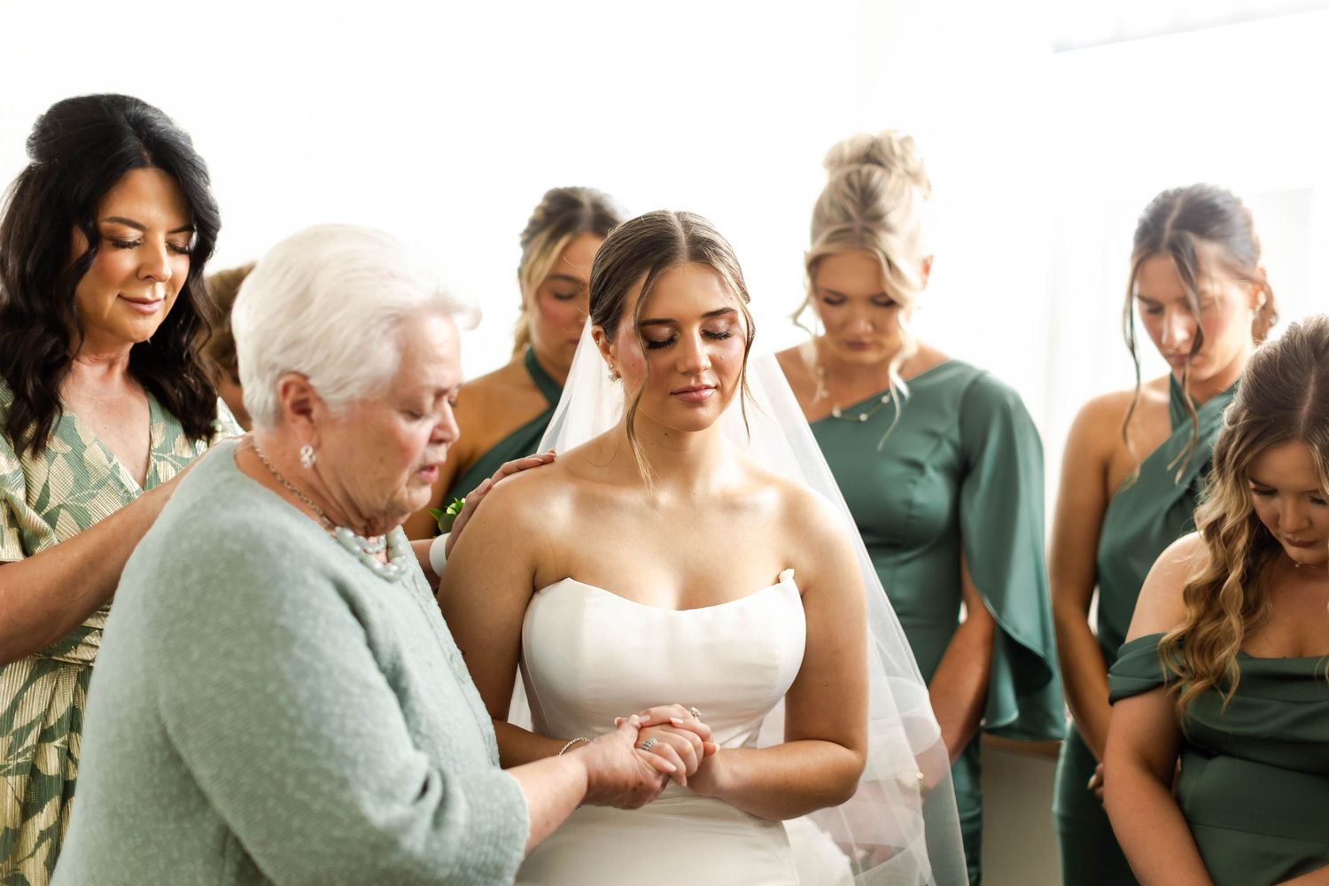 Emotional wedding ceremony moment with guests watching and reacting in an intimate indoor setting.