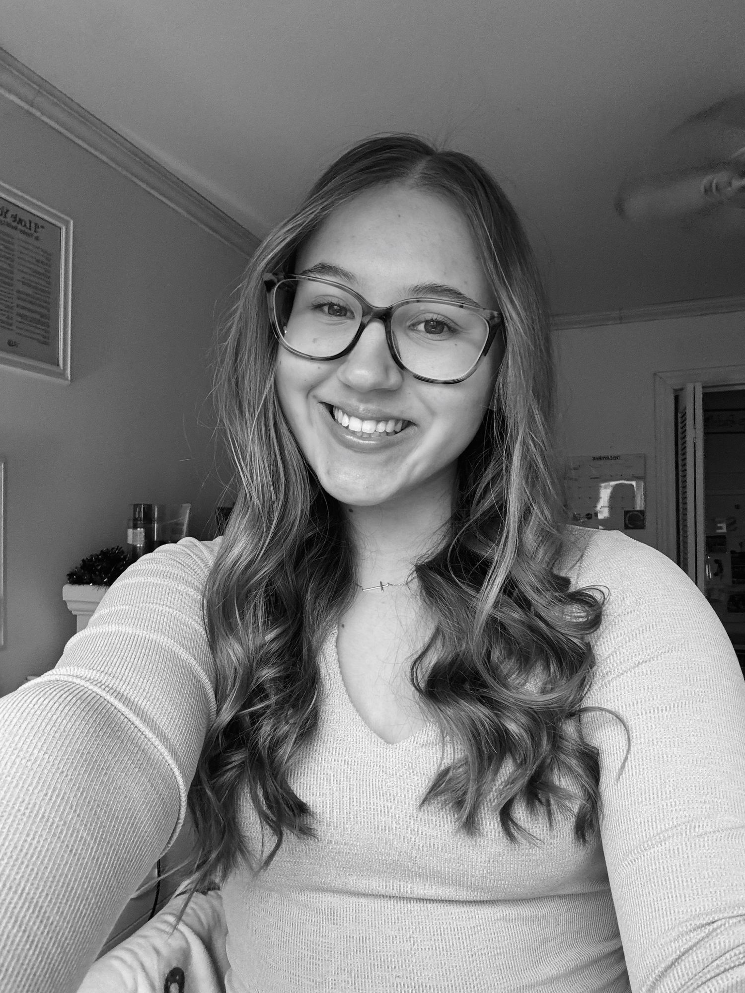 Black and white selfie series showing casual expressions in natural light.