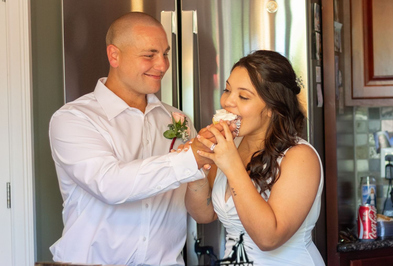 Wedding party members sharing playful moments while getting ready.