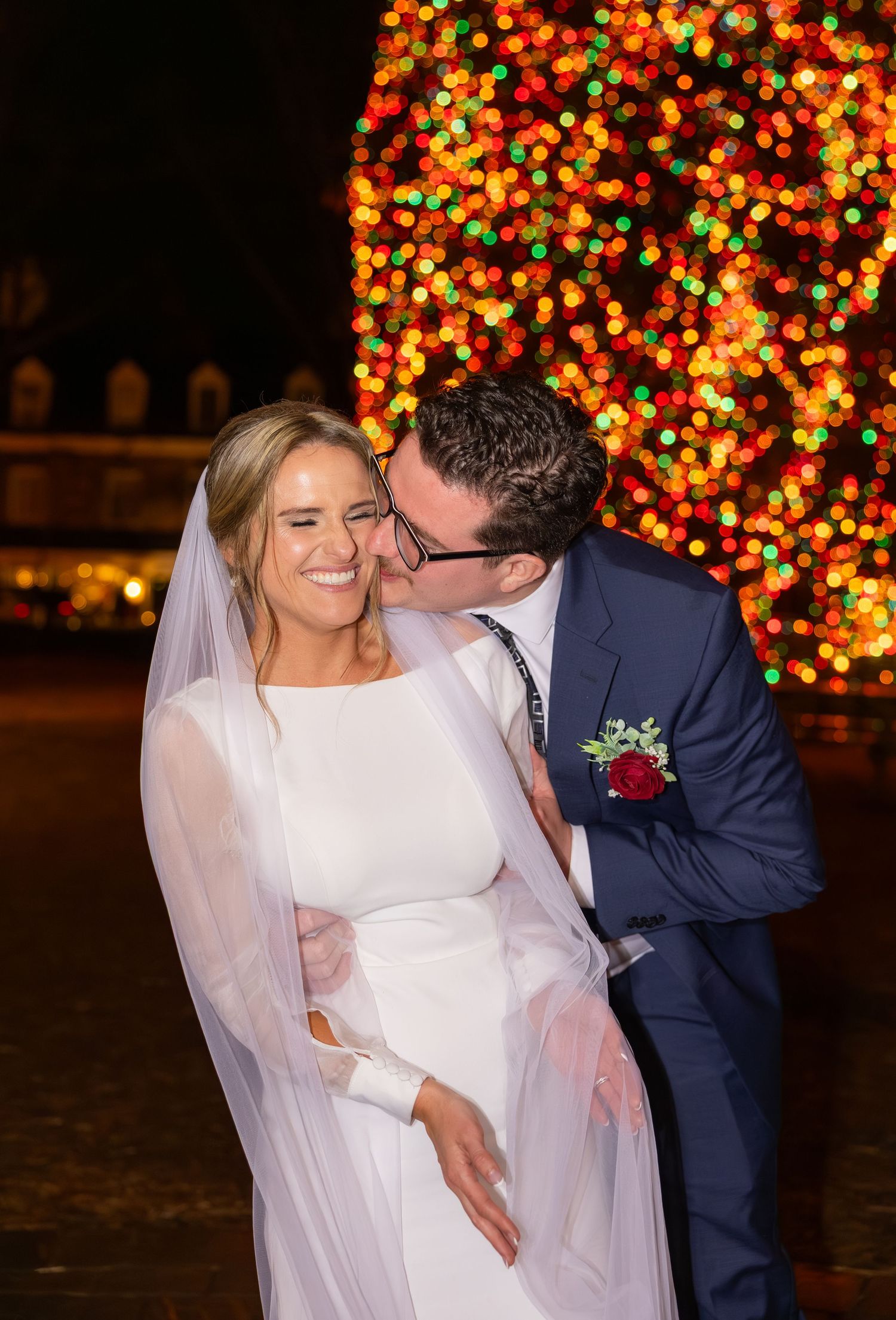 Romantic nighttime wedding photos with illuminated trees creating a magical backdrop.