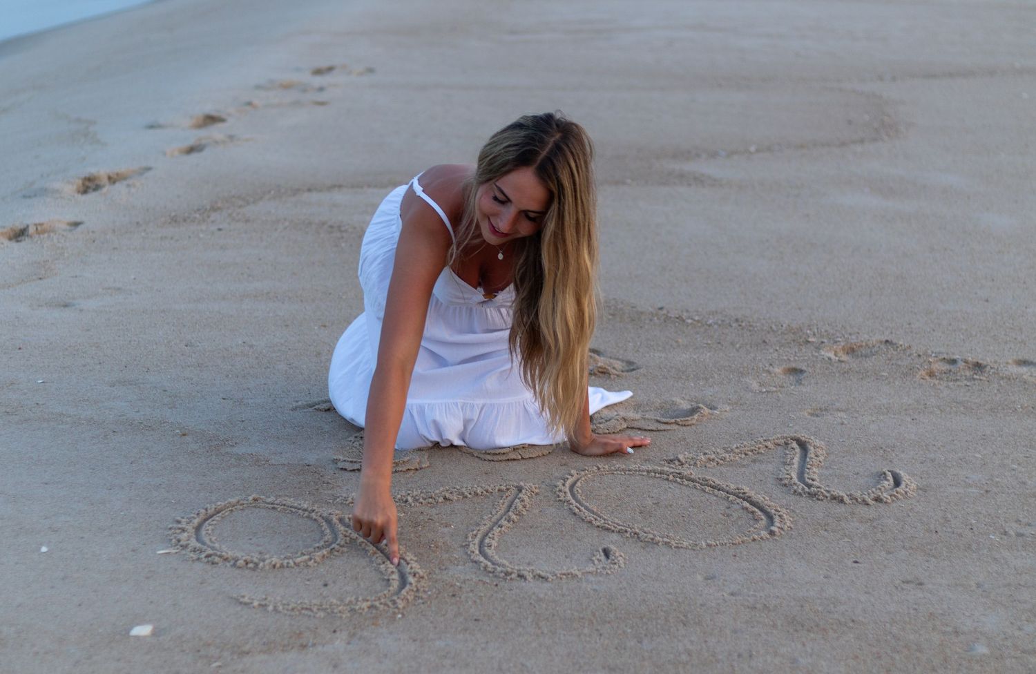 Person in white dress drawing 