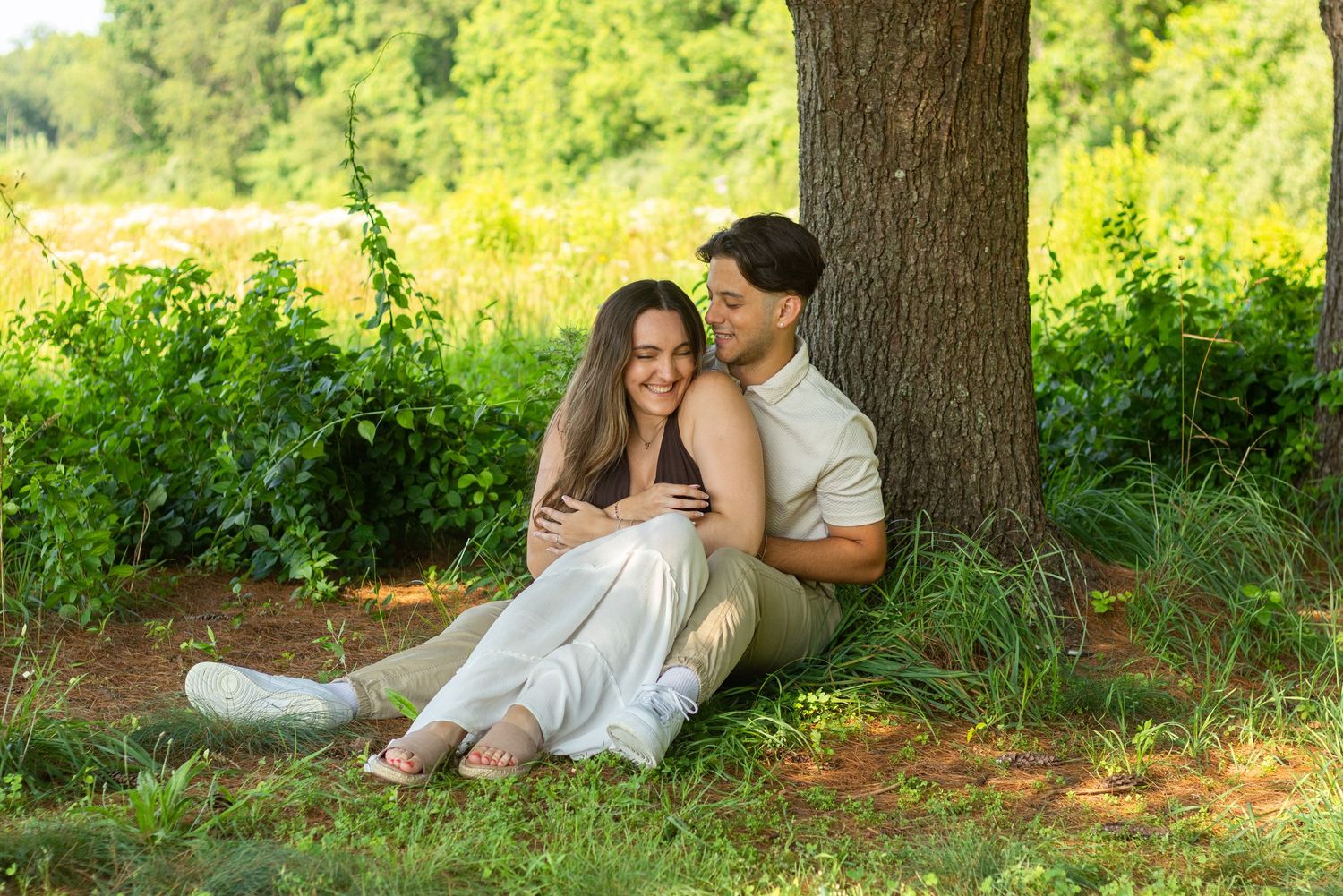 Romantic couple photos taken under shady trees in a natural outdoor setting.