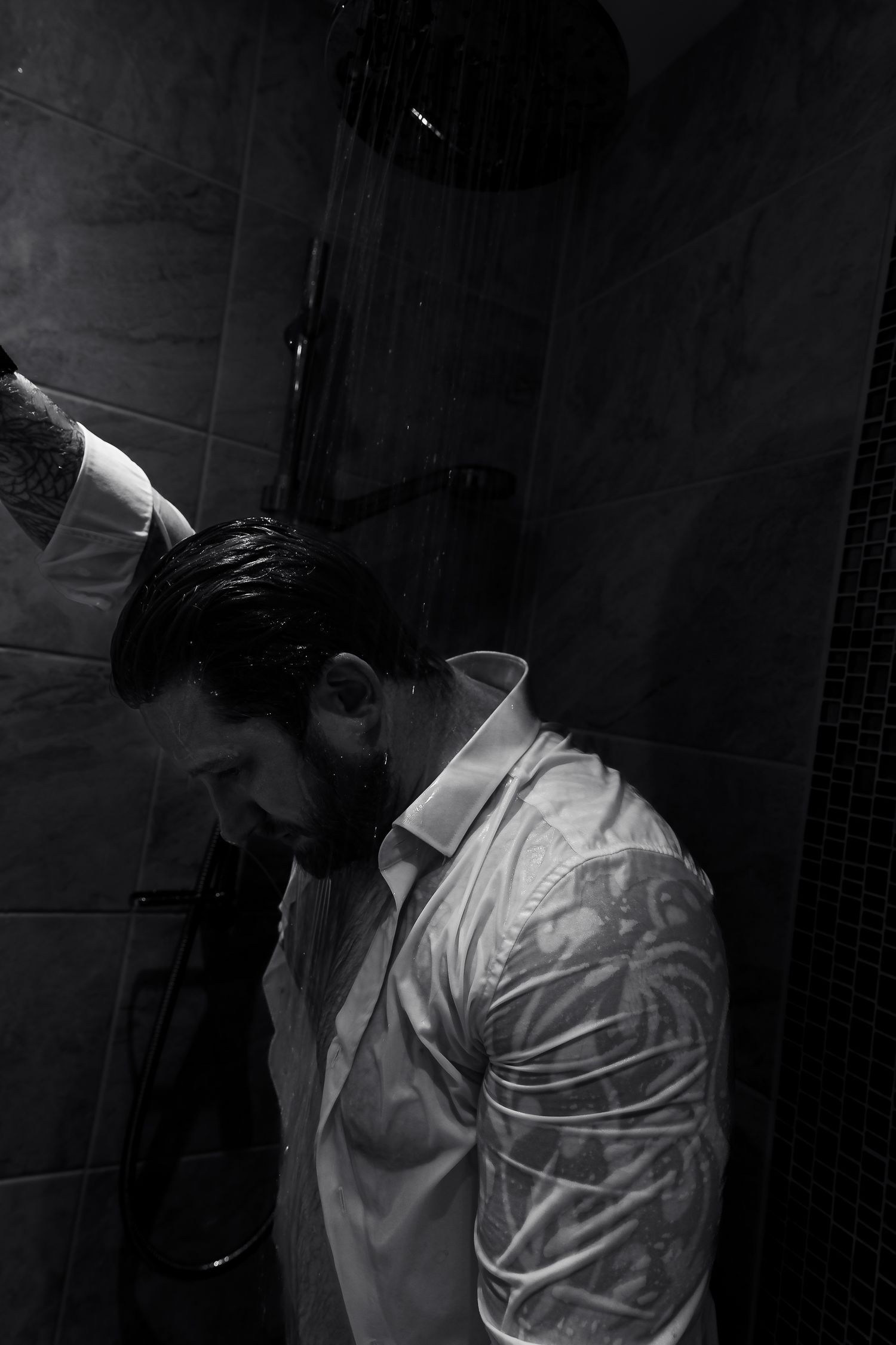 Artistic black and white series featuring white shirt in dramatic lighting.