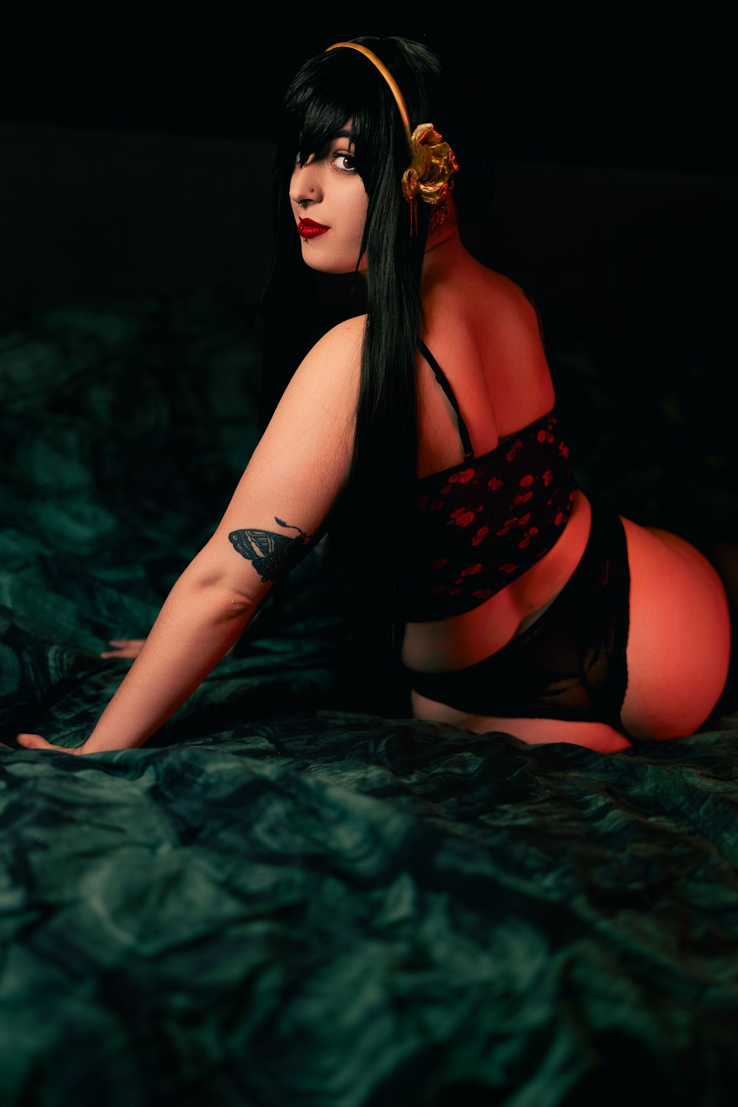 Dramatic dark boudoir photos with red lighting and smoky atmosphere.