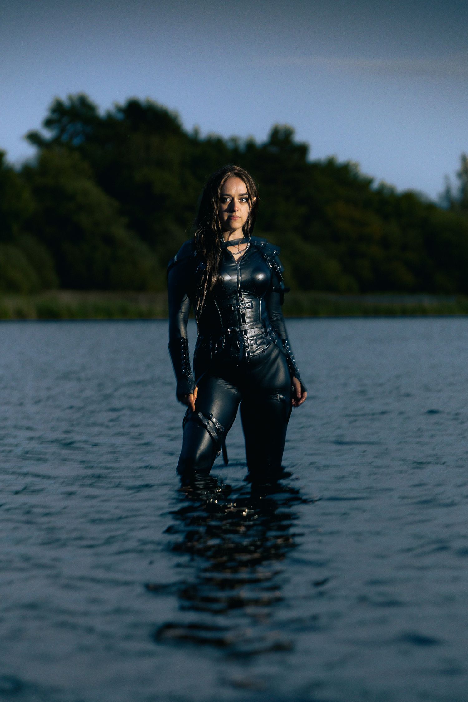 Atmospheric water photography featuring a person in diving gear emerging from a lake.