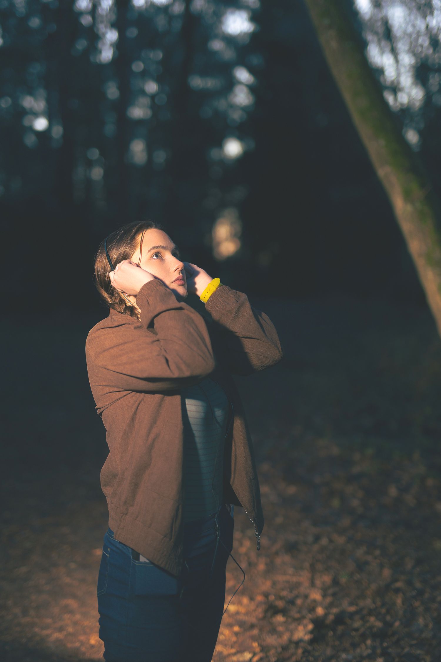Sequence of photos showing someone in a brown jacket against an autumn forest background.