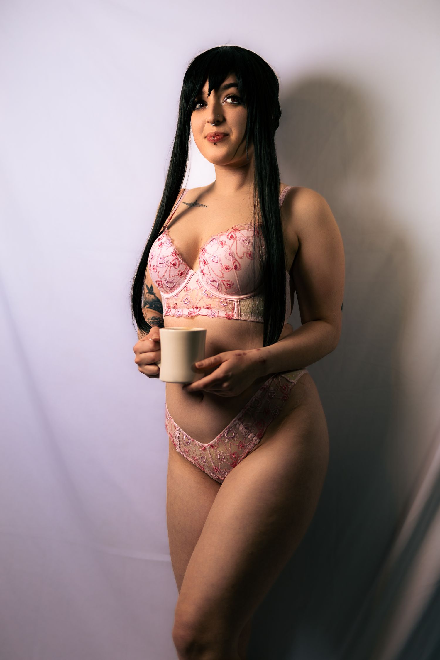 Intimate portrait series showing pink lace lingerie against a light backdrop.