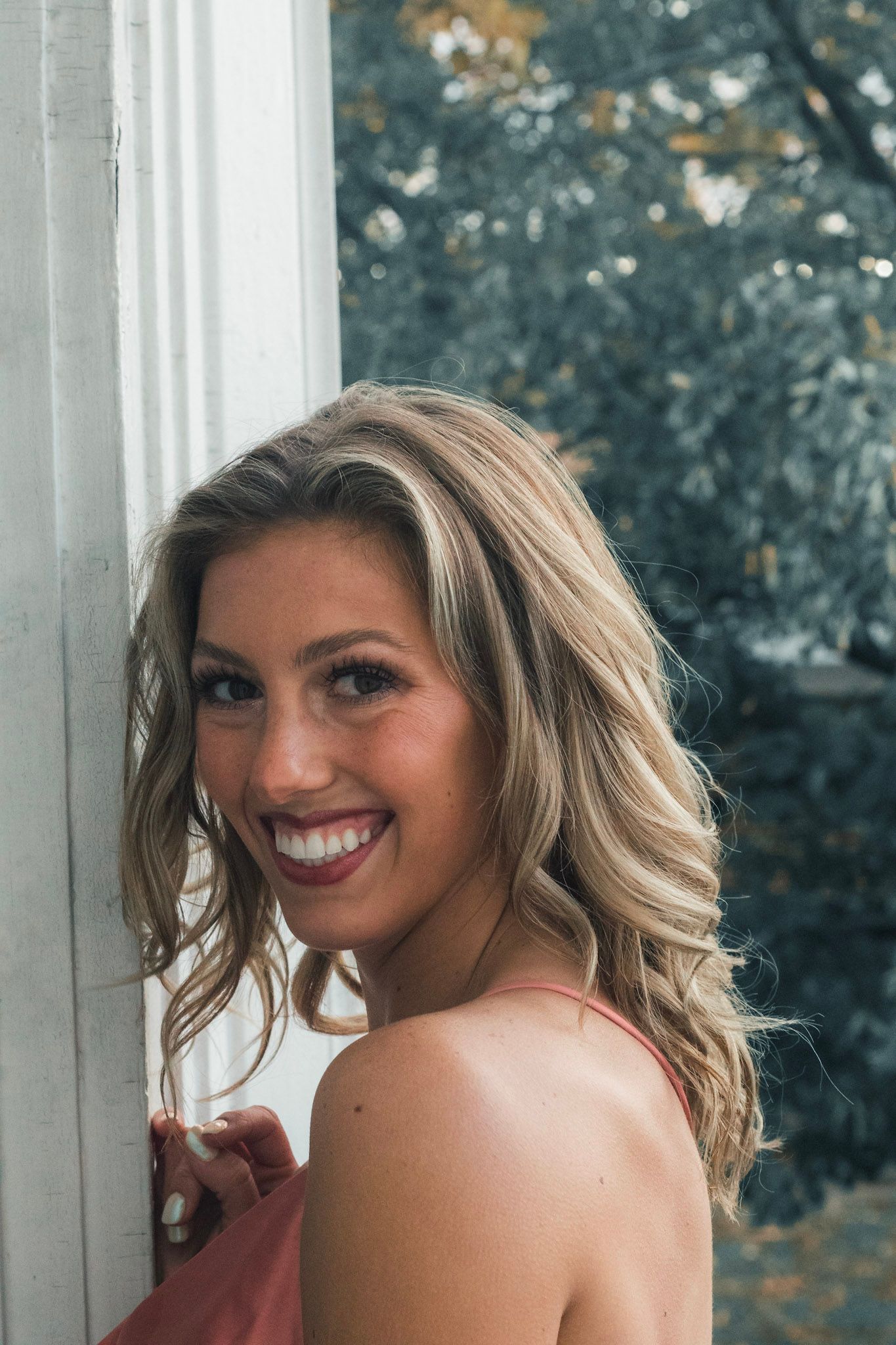 Senior photo session in Lapeer, Michigan showcasing a confident high school senior outdoors