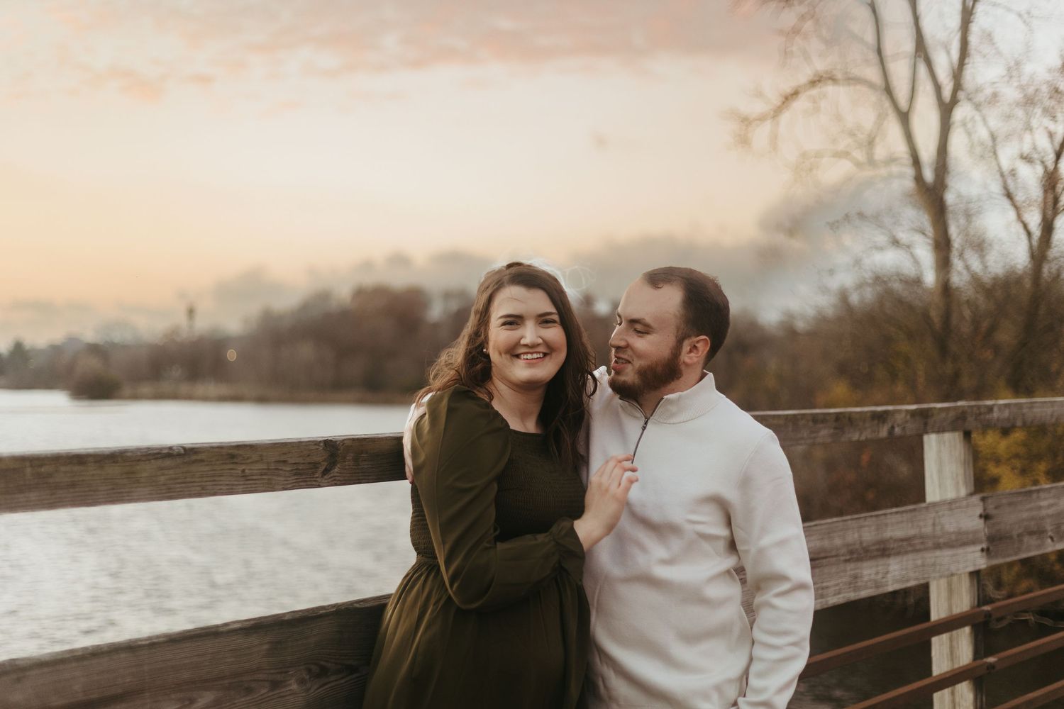 Candid couples photo session in Ann Arbor, Michigan captured in a park at golden hour