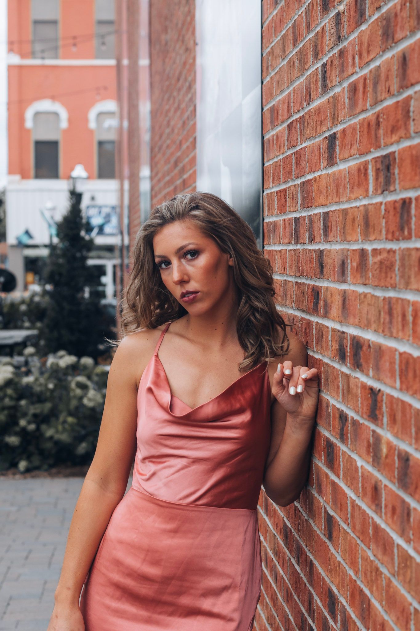 Senior photo session in Lapeer, Michigan showcasing a confident high school senior outdoors