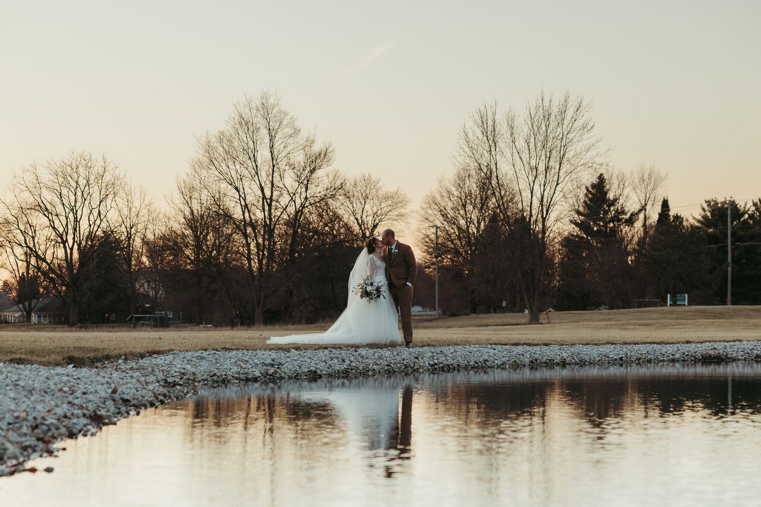Newlyweds sharing a quiet moment at their Indiana wedding in early spring.
