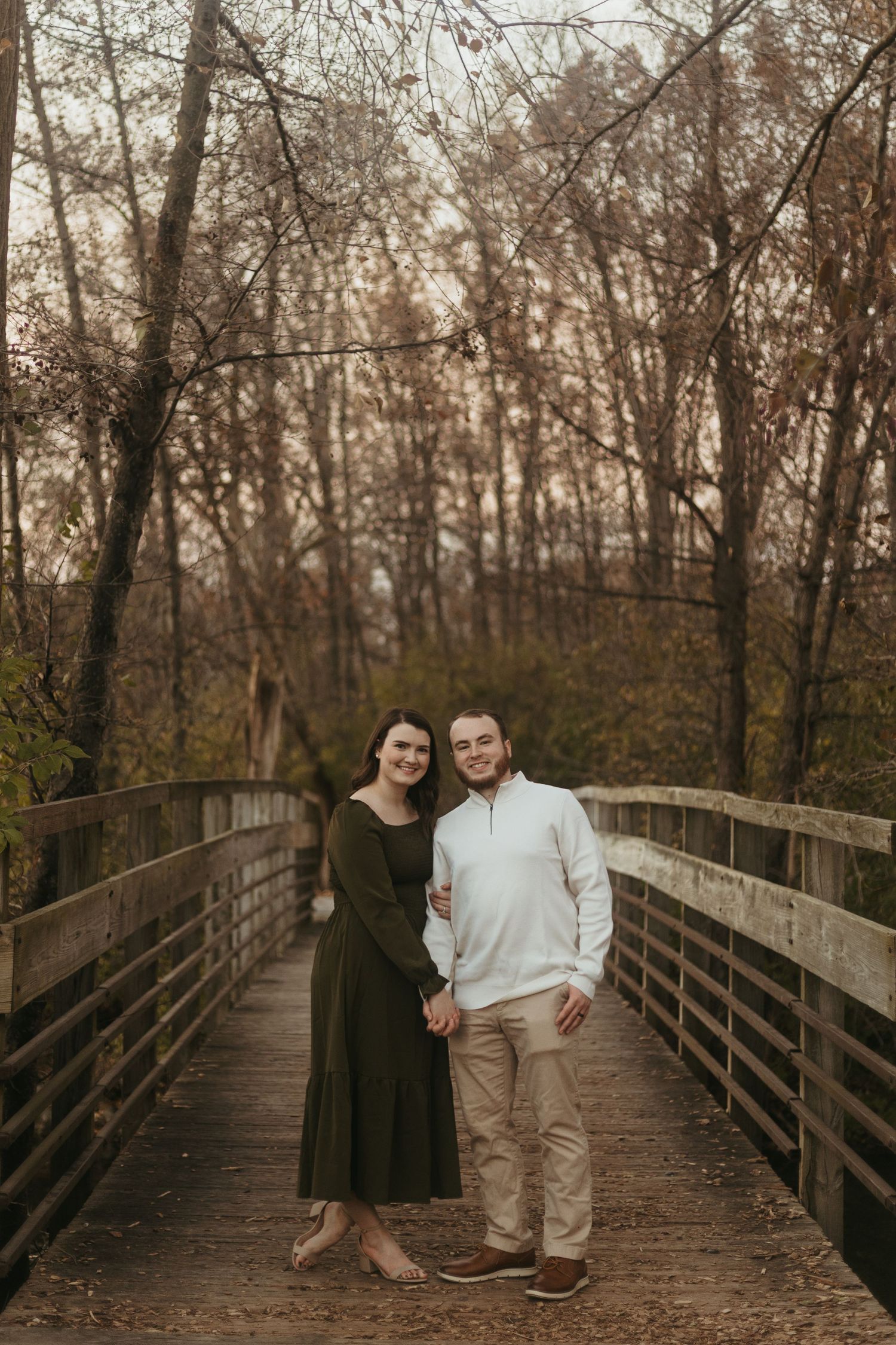 Sunset couples portrait in Ann Arbor, Michigan featuring a couple walking together in a scenic park