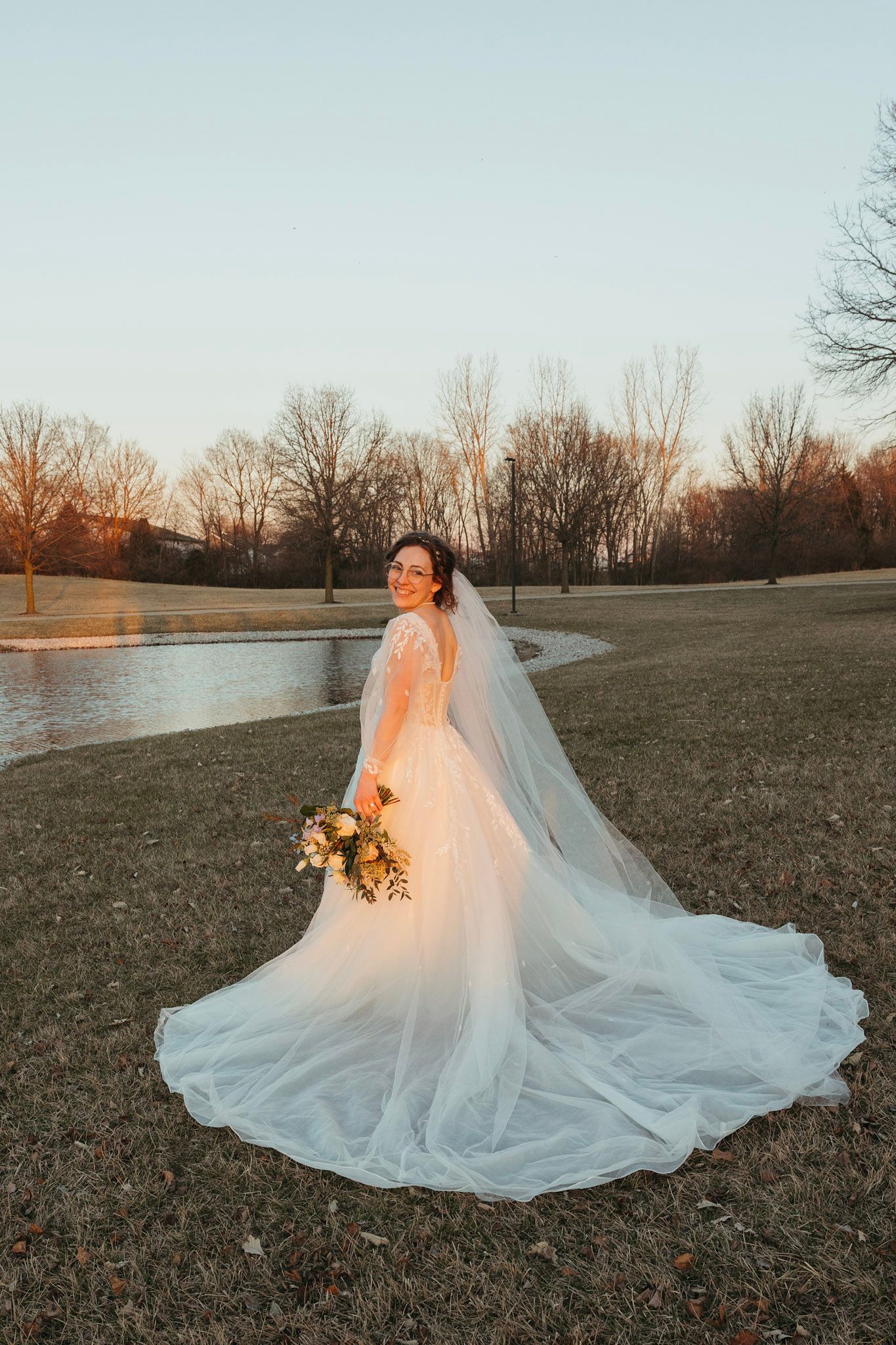 Bride in her wedding dress during a March wedding in Indiana, captured in soft natural light.
