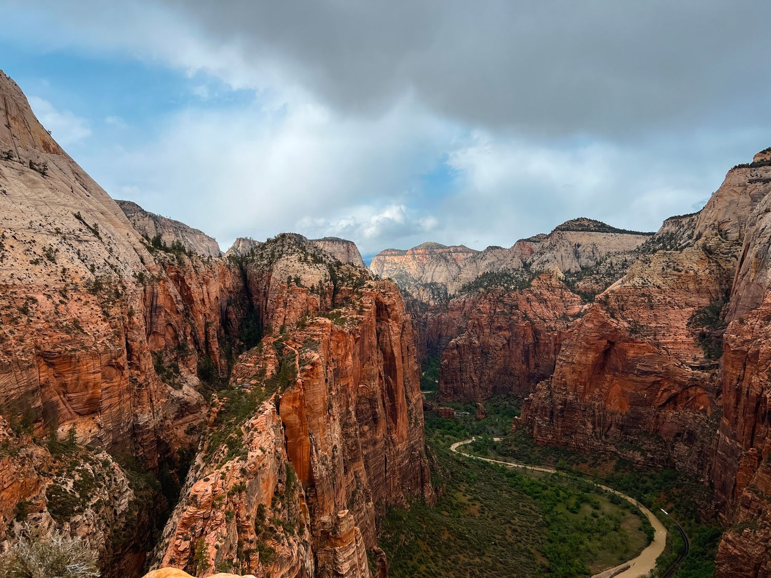 View from the top of Angels Landing in Zion National Park overlooking dramatic canyon cliffs