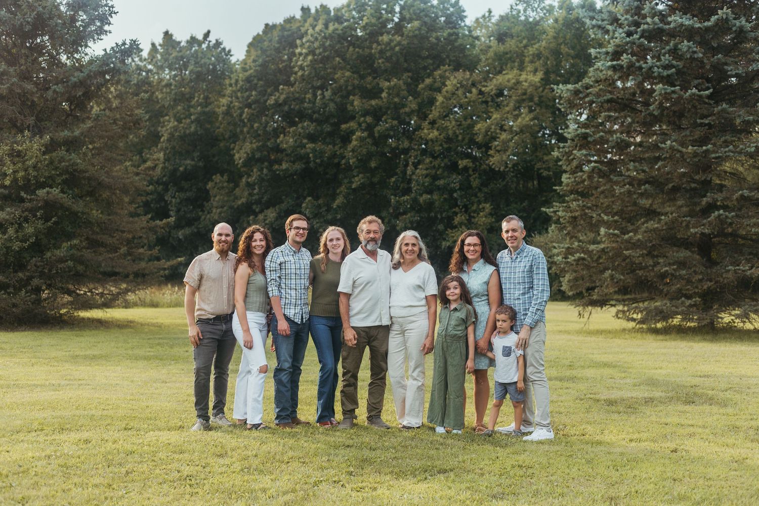 Lapeer Michigan family photography capturing a multi-generation family portrait outdoors in natural light