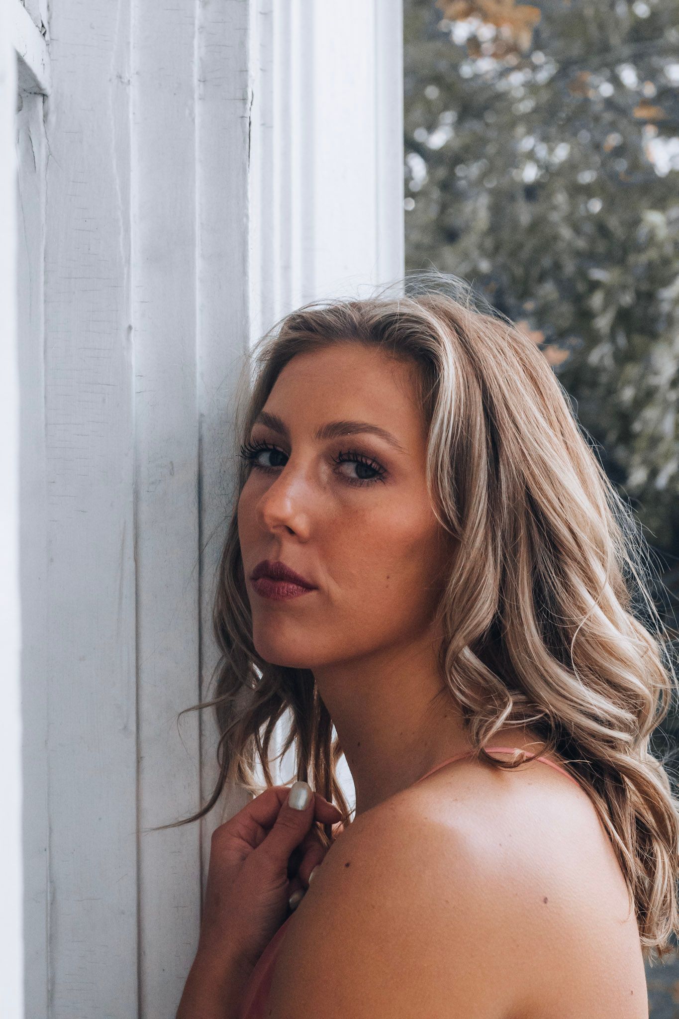 Outdoor senior portrait in Lapeer, Michigan with a relaxed and natural style