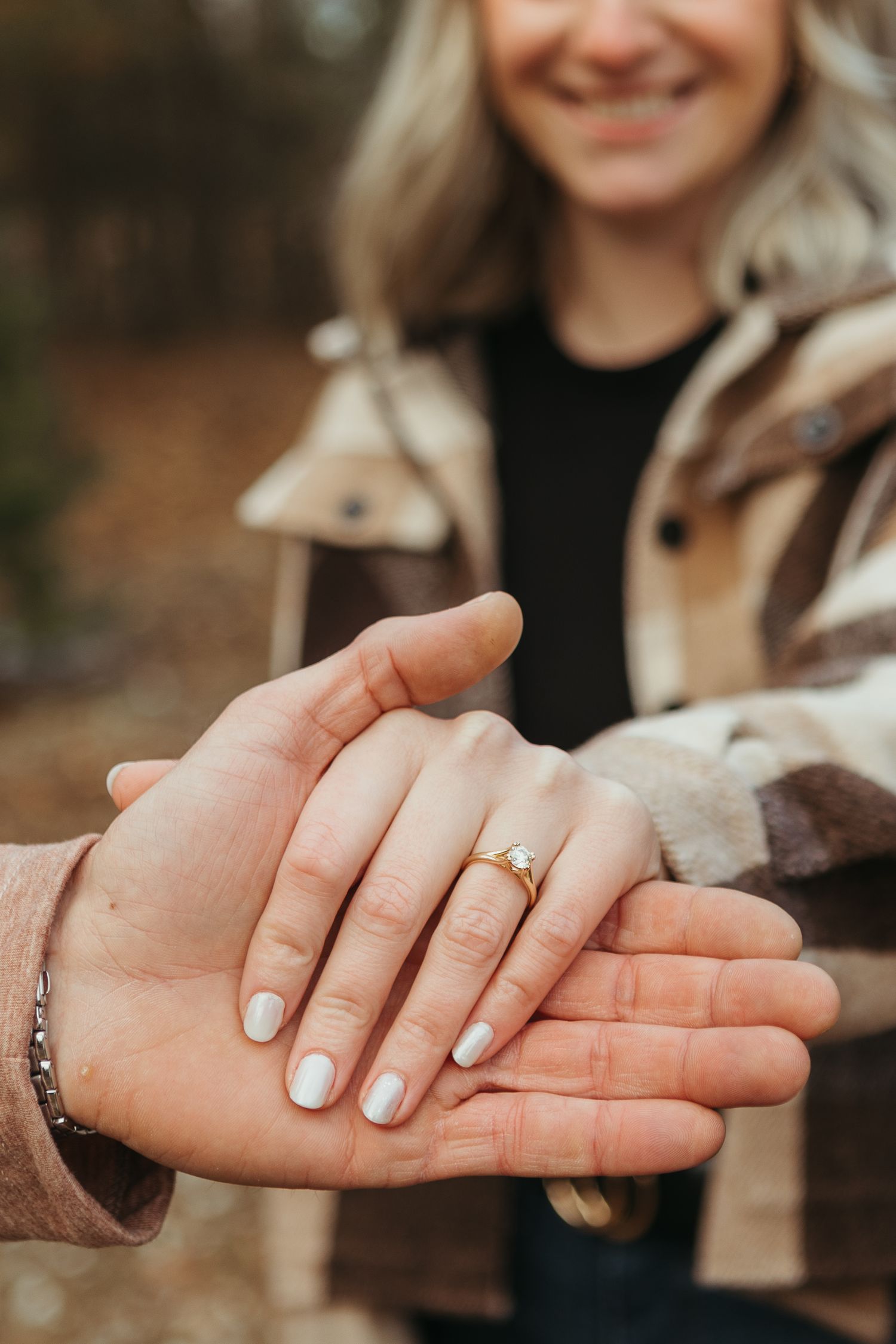 Winter engagement photo session in Lapeer, Michigan featuring a couple outdoors in a snowy natural setting