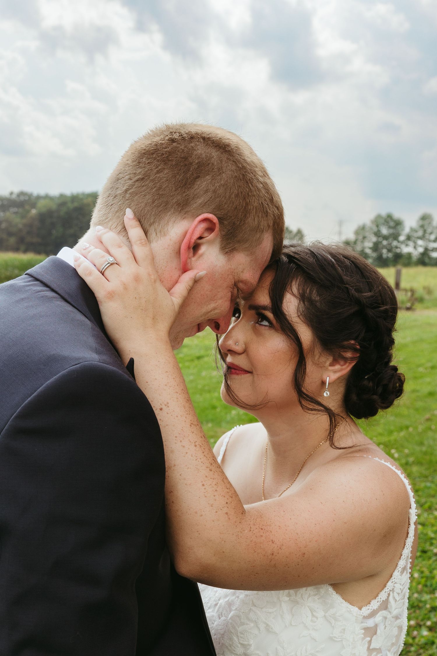 New Boston Michigan wedding photography capturing an intimate couple moment during an August outdoor wedding