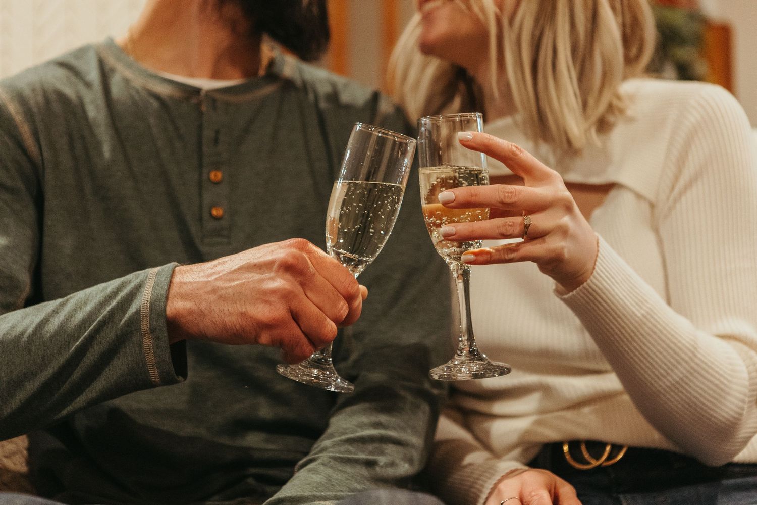In-home winter engagement photos in Lapeer, Michigan capturing a couple together in a warm and intimate setting