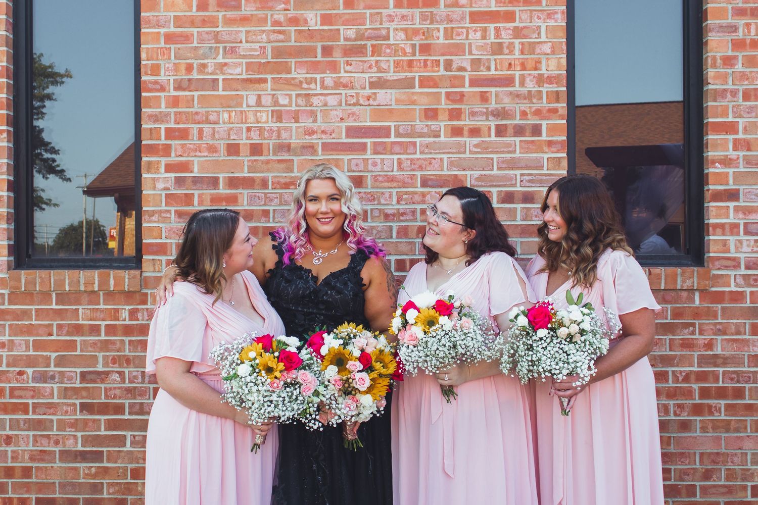 Wedding party group portrait at a Flint, Michigan wedding photographed outdoors in natural light