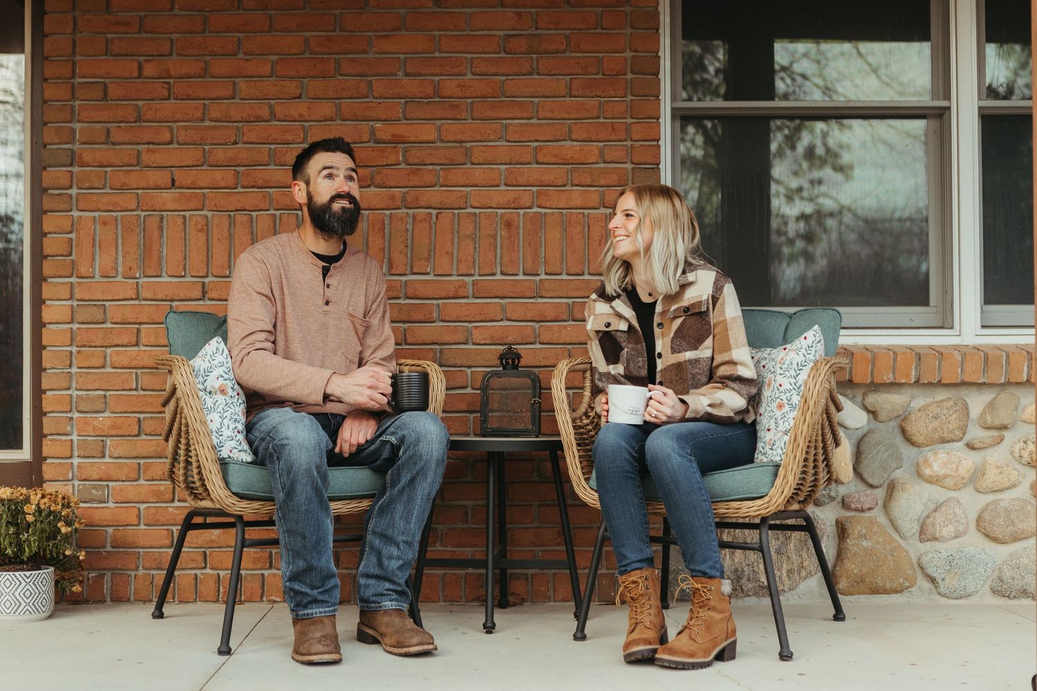 In-home winter engagement photos in Lapeer, Michigan capturing a couple together in a warm and intimate setting