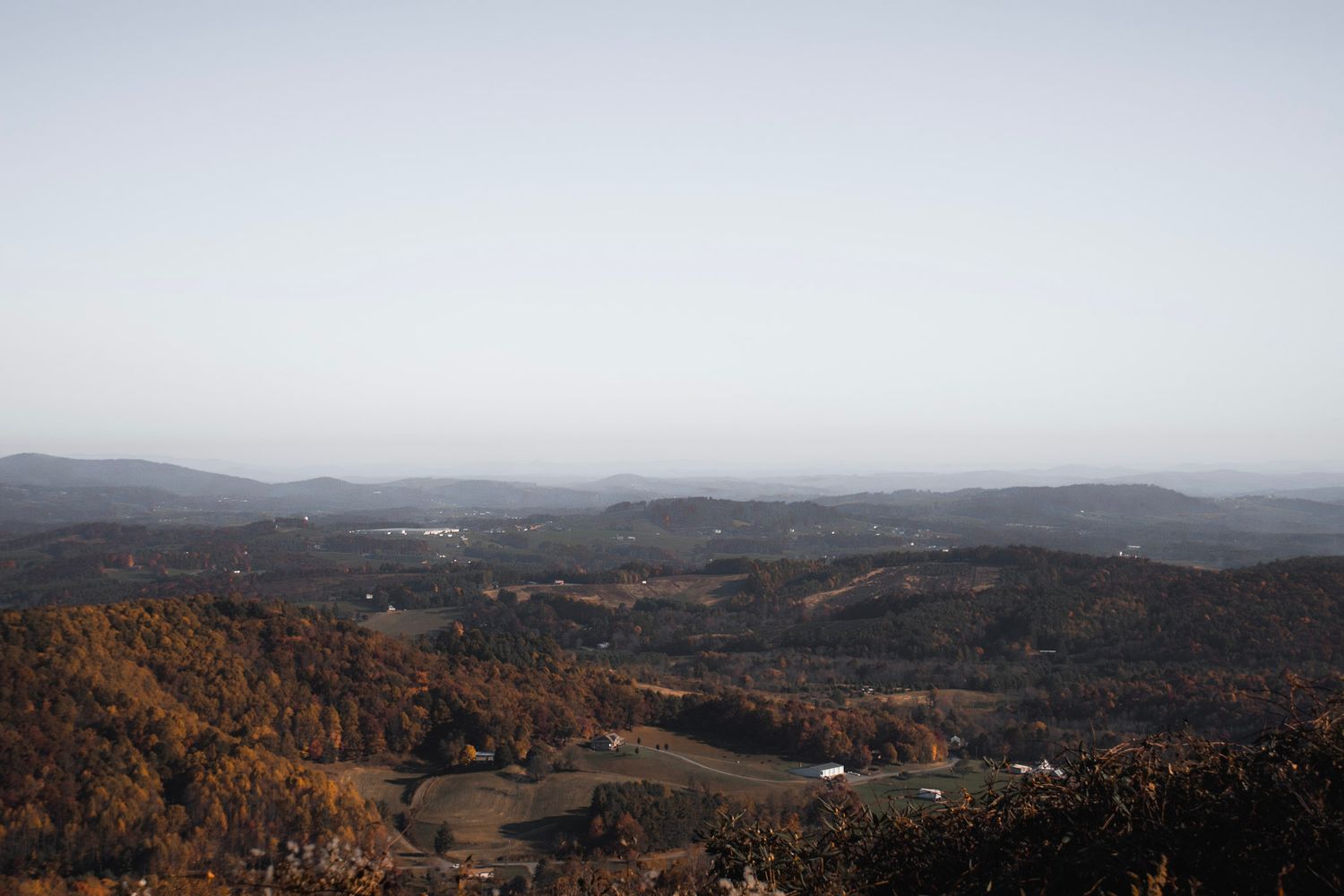 Fall view of a small city along the Blue Ridge Parkway surrounded by colorful autumn foliage