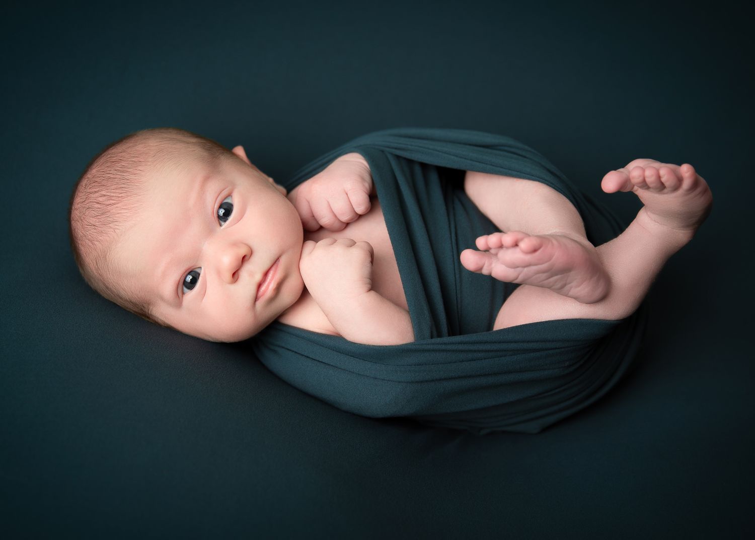 Fallbrook CA newborn photography studio offering posed baby portraits with wraps and props by Sarah Bracci Photographics.