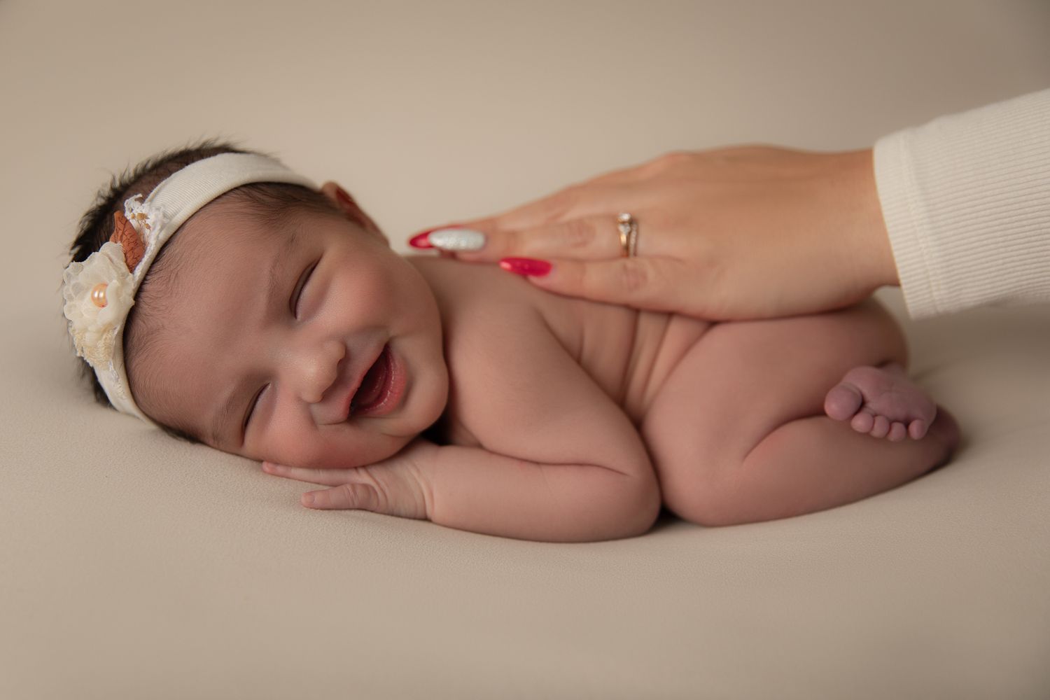Fallbrook CA newborn photography studio offering posed baby portraits with wraps and props by Sarah Bracci Photographics.