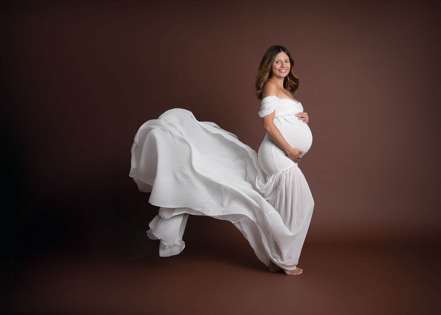 Pregnancy portrait session in Fallbrook CA with expecting mother photographed in studio maternity photography setting