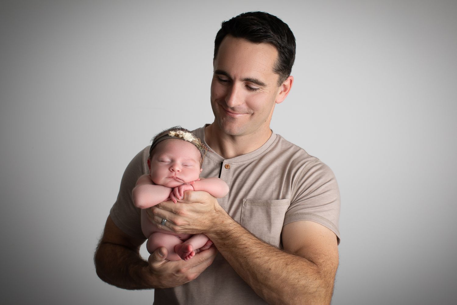 Professional newborn photographer in Vista CA capturing studio posed baby portraits in a private North County San Diego photography studio.