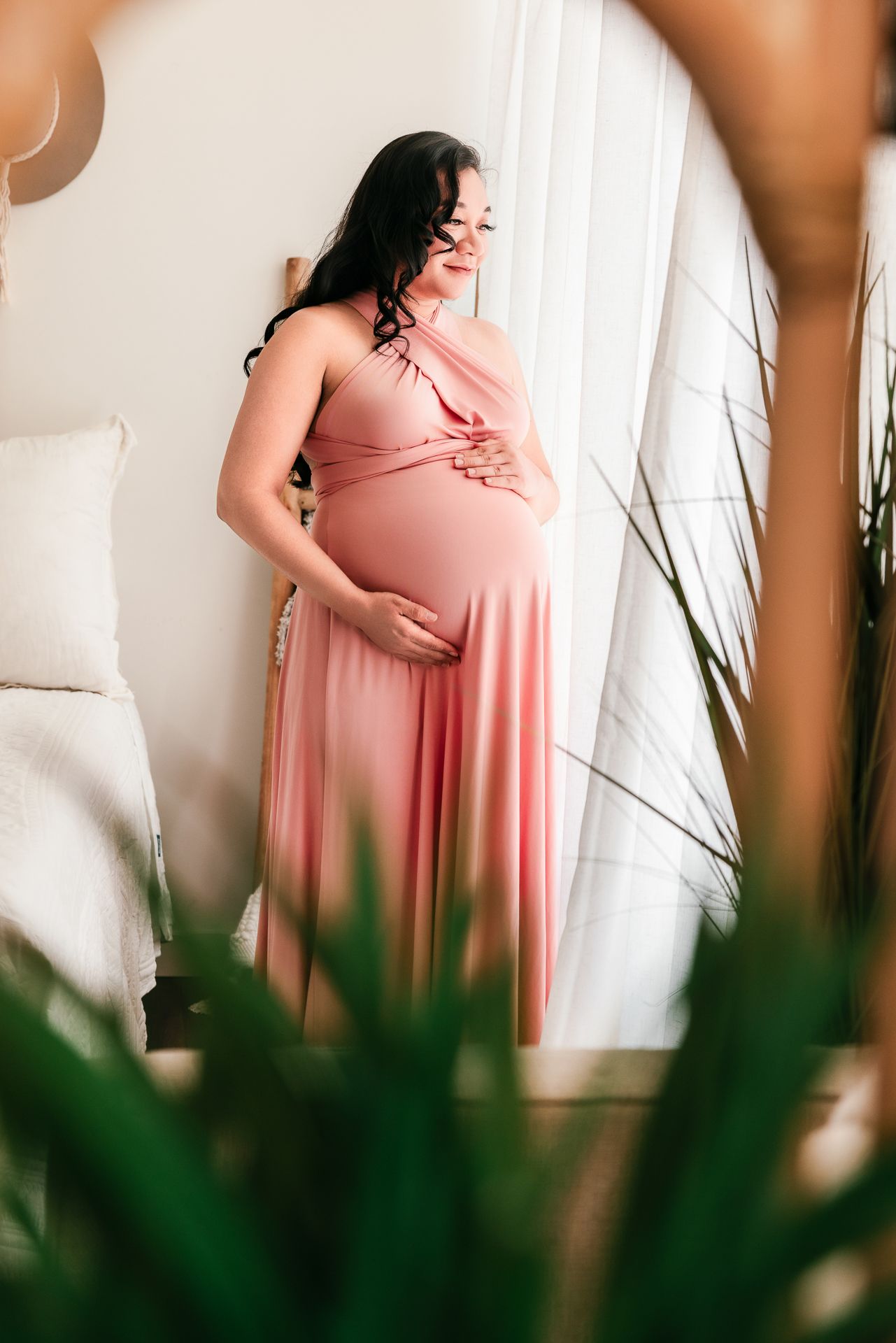 Light and airy maternity portrait session in Bonsall CA for expecting mother photographed in studio setting