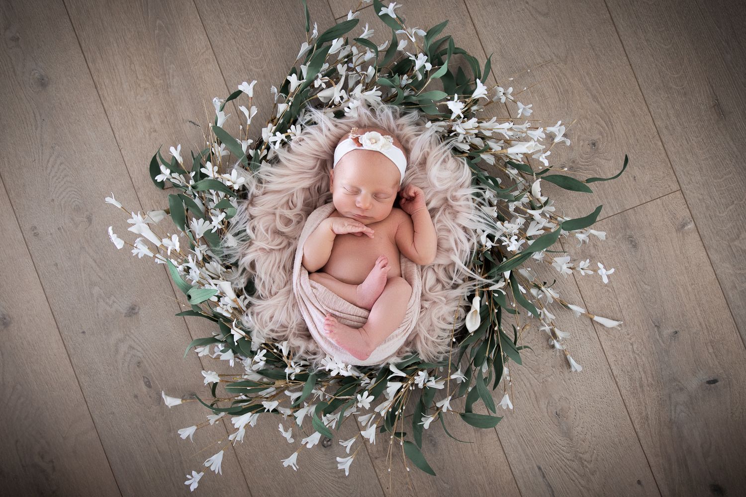 Vista CA newborn photography studio offering posed baby portraits with wraps and props by Sarah Bracci Photographics.