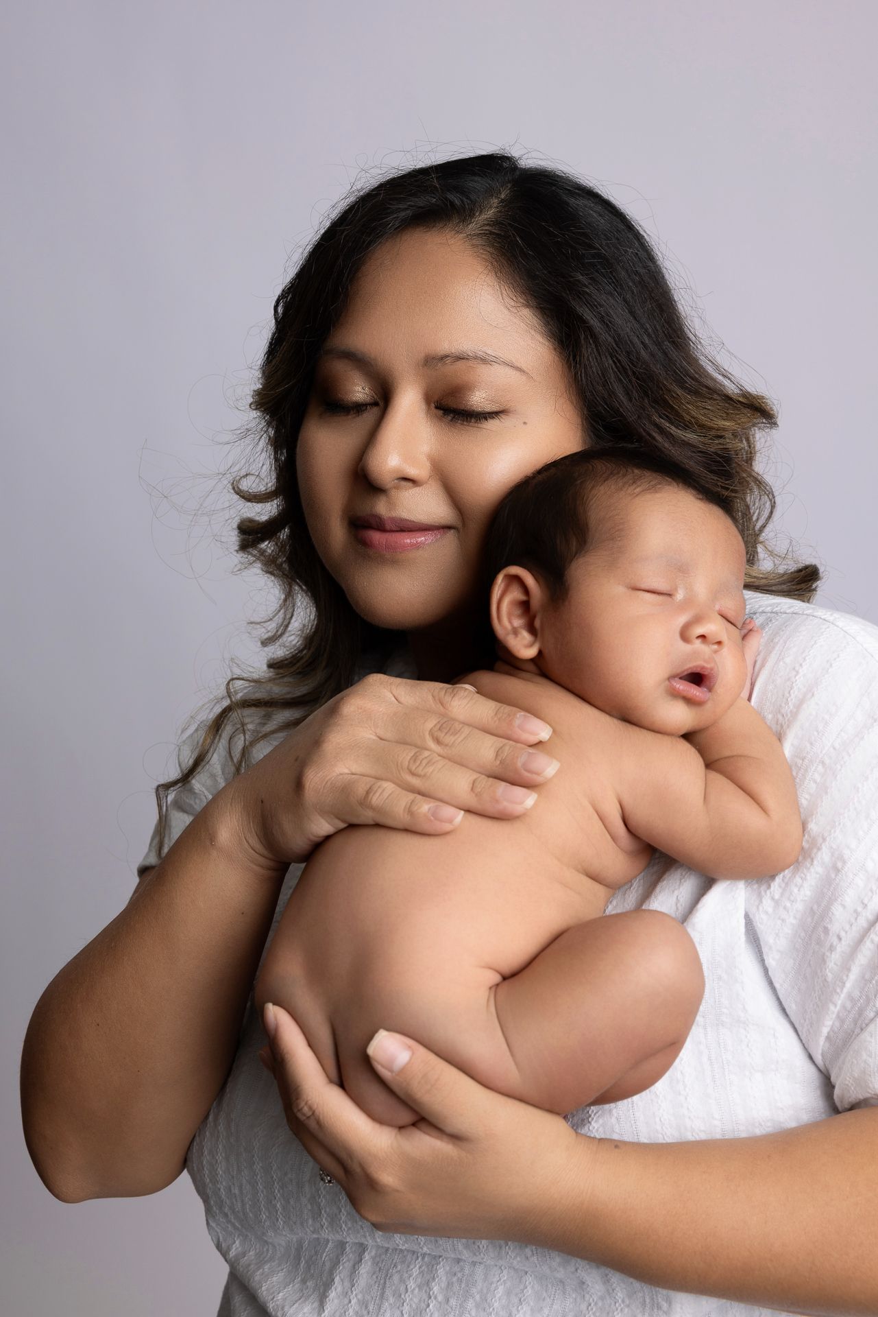 Fallbrook CA newborn photography studio offering posed baby portraits with wraps and props by Sarah Bracci Photographics.