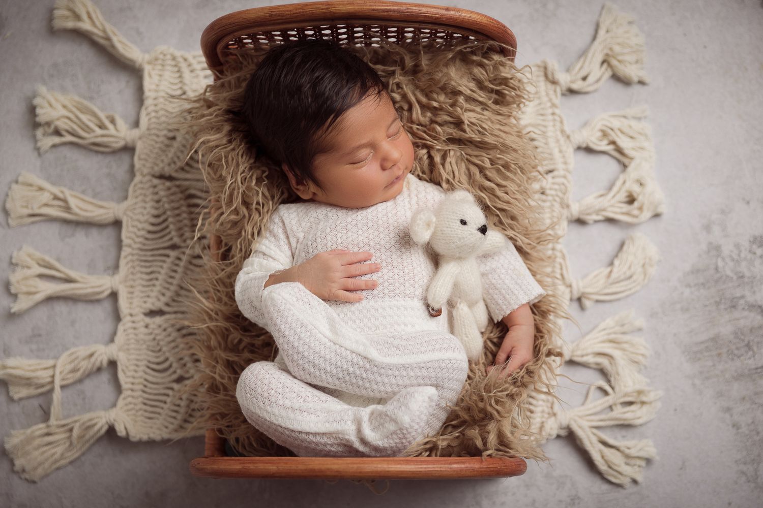 San Marcos CA newborn photography studio offering posed baby portraits with wraps and props by Sarah Bracci Photographics.