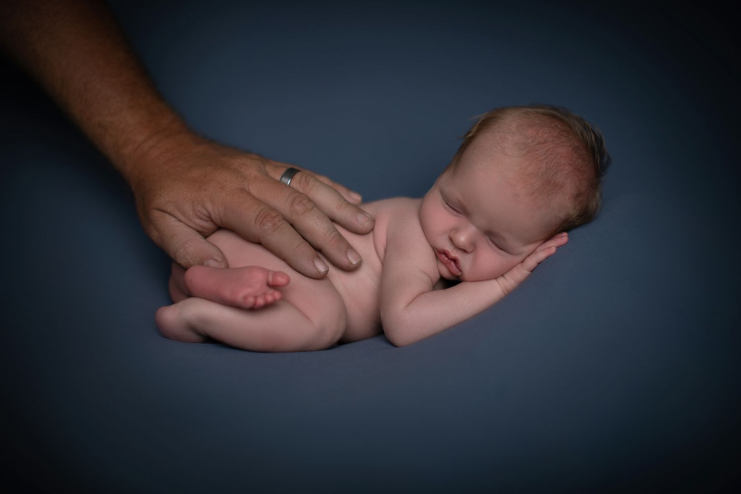 Temecula newborn photographer providing studio posed newborn portraits in a private Bonsall photography studio.