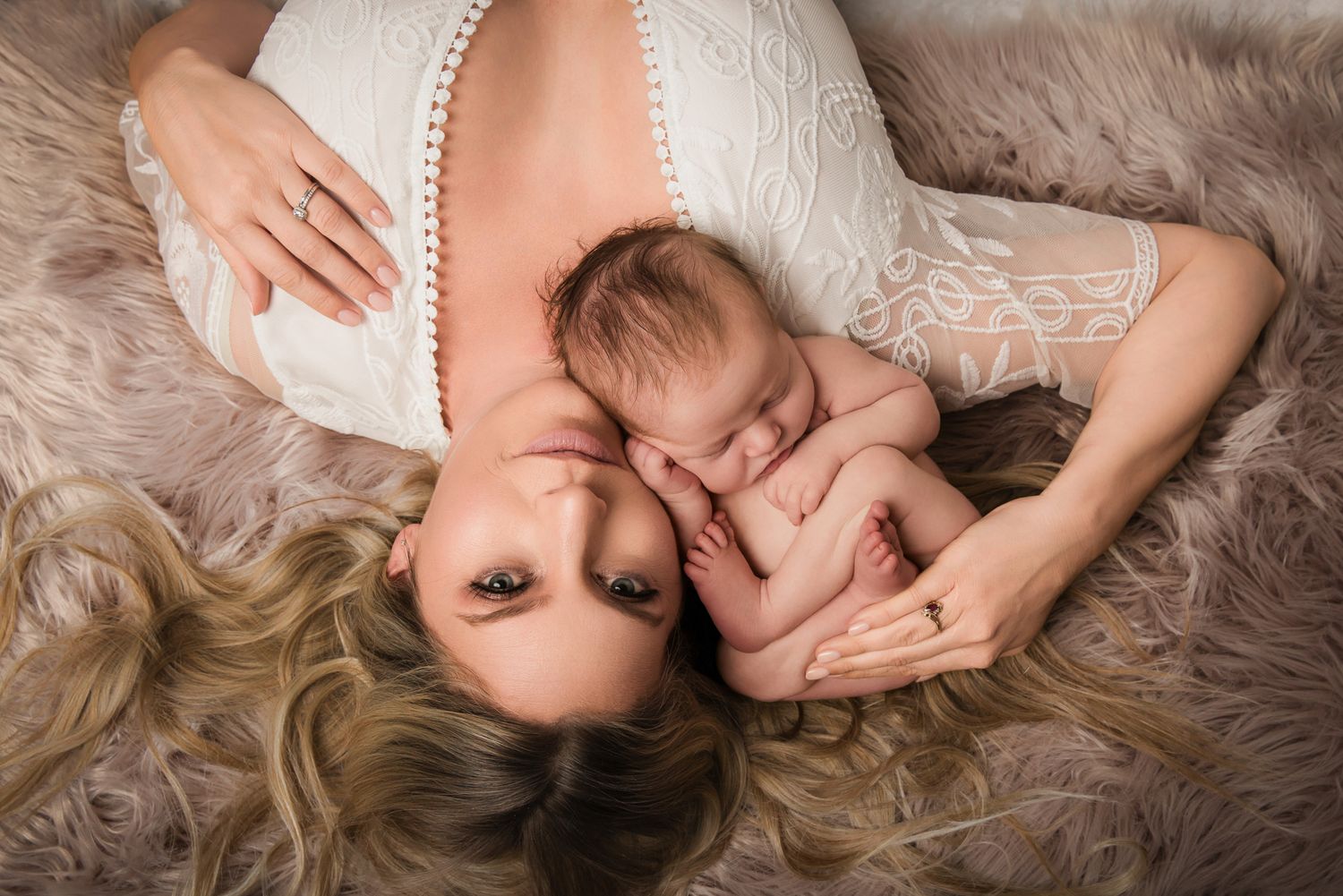 A collection of intimate newborn photography portraits showing tender moments between parent and baby on soft textures in the Bonsall Studio