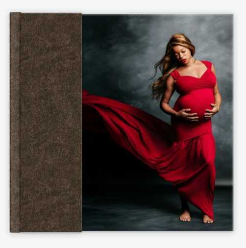 Square dark linen photo album with a stunning maternity portrait of a woman in a billowing red dress.