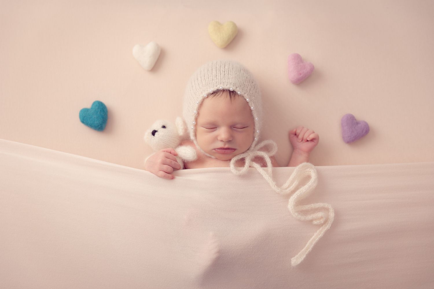 Oceanside CA newborn photographer specializing in studio baby portraits with timeless styling for North County San Diego families.